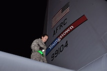 RAMSTEIN AIR BASE, Germany -- Air Force Reserve Staff Sgt. Rachele Sampson, an aircraft mechanic assigned to the 910th Maintenance Squadron, based at Youngstown Air Reserve Station, Ohio, uses a flashlight to perform her part of a basic post-flight inspection on a C-130H Hercules tactical cargo transport aircraft assigned to the 910th Airlift Wing, also based at YARS, on the flightline here, October 20, 2009. The aircraft returned to Ramstein Air Base after completing an airlift mission from Tel Aviv, Israel, hauling a cargo compartment full of supplies and equipment. Sergeant Sampson is checking the aircraft's fussealge, wing and stabilizer surfaces for cracks, defects, fluid leaks as well as burned-out exterior lights. The purpose of the basic post-flight inspection is to check the C-130 for any structural defects and mechanical or electrical failures or anything else not within operating standards for the aircraft. The YARS maintenance personnel, the C-130 and its crew are attached to the 38th Expeditionary Airlift Wing, base here, in support of Operation Joint Enterprise. More than 70 Airmen consisting of flight crews, maintenance personnel and support staff are currently attached to the 38th EAS with the airlift mission that will support locations in the U.S. Europe Command (EUROCOM), the U.S. Africa Command (AFRICOM) and the U.S. Central Command (CENTCOM) theaters of operations. U.S. Air Force photo by Master Sgt. Bob Barko Jr.      