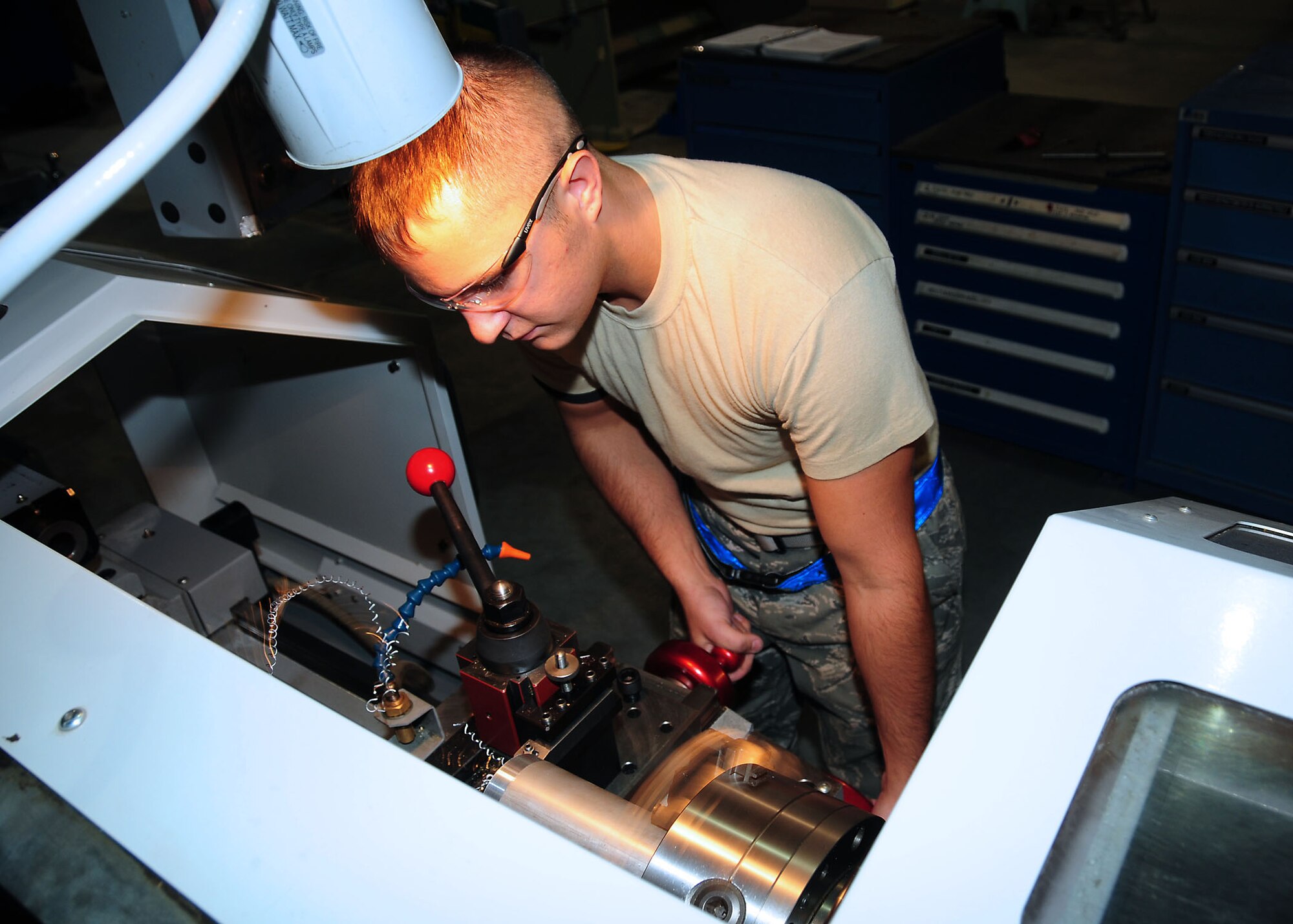SOUTHWEST ASIA -- Senior Airman Steven Edwards, 386th Expeditionary Maintenance Squadron metals technician, operates a lathe at an undisclosed location in Southwest Asia Oct. 20, 2009.  Airman Edwards is deployed from the 509th Maintenance Squadron, Whiteman Air Force Base, Mo., and hails from Charleston, S.C.  (U.S. Air Force photo/Tech. Sgt. Tony Tolley)