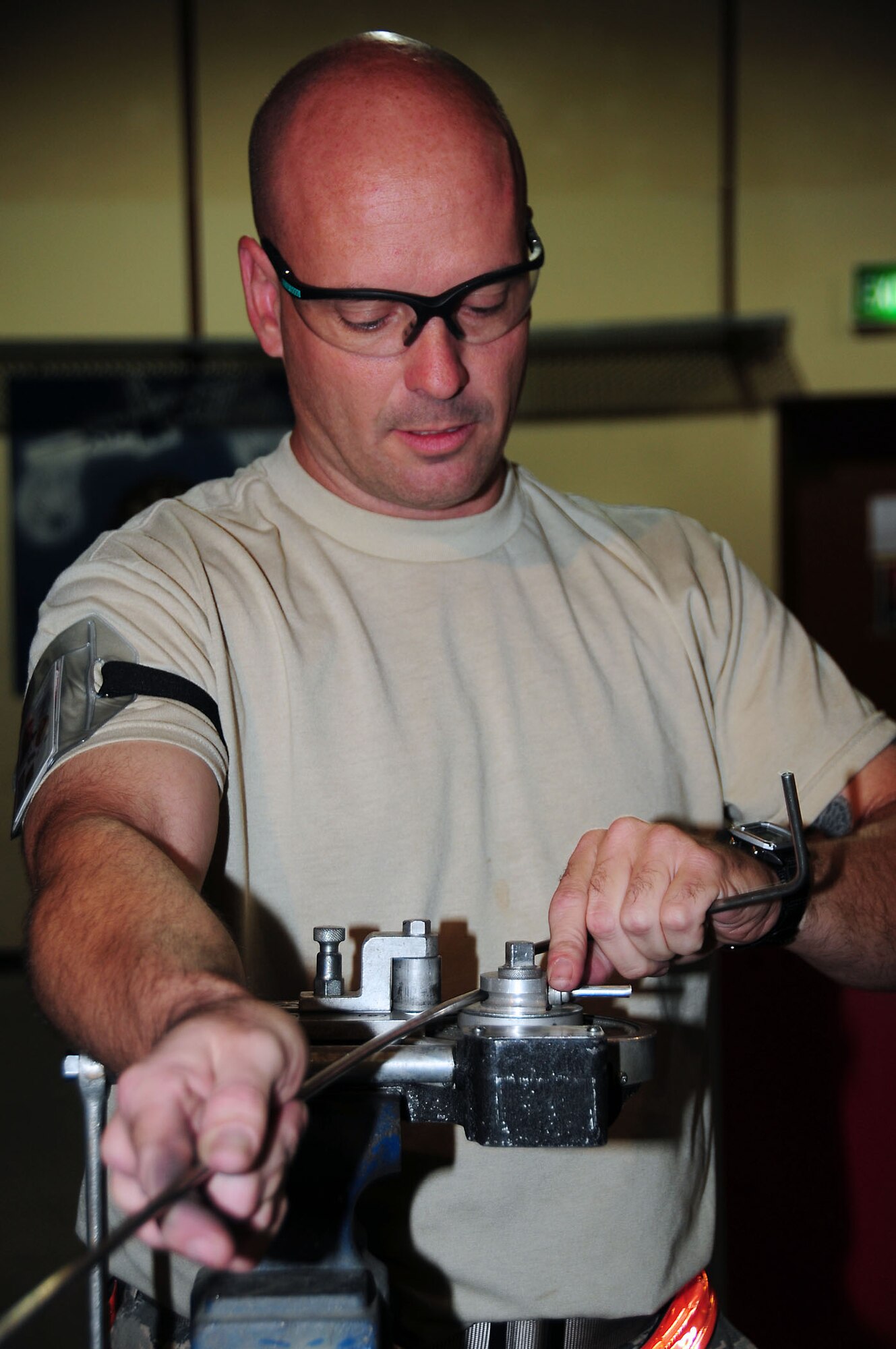 SOUTHWEST ASIA -- Tech. Sgt. Charles Sandwell, 386th Expeditionary Maintenance Squadron metals technician, uses a hand tubing bender to make a booster hydraulic line at an undisclosed location in Southwest Asia Oct. 20, 2009.  Sergeant Sandwell is deployed from the 7th Equipment Maintenance Squadron, Dyess Air Force Base, Texas and hails from Mount Carmel, Ill.  (U.S. Air Force photo/Tech. Sgt. Tony Tolley)
