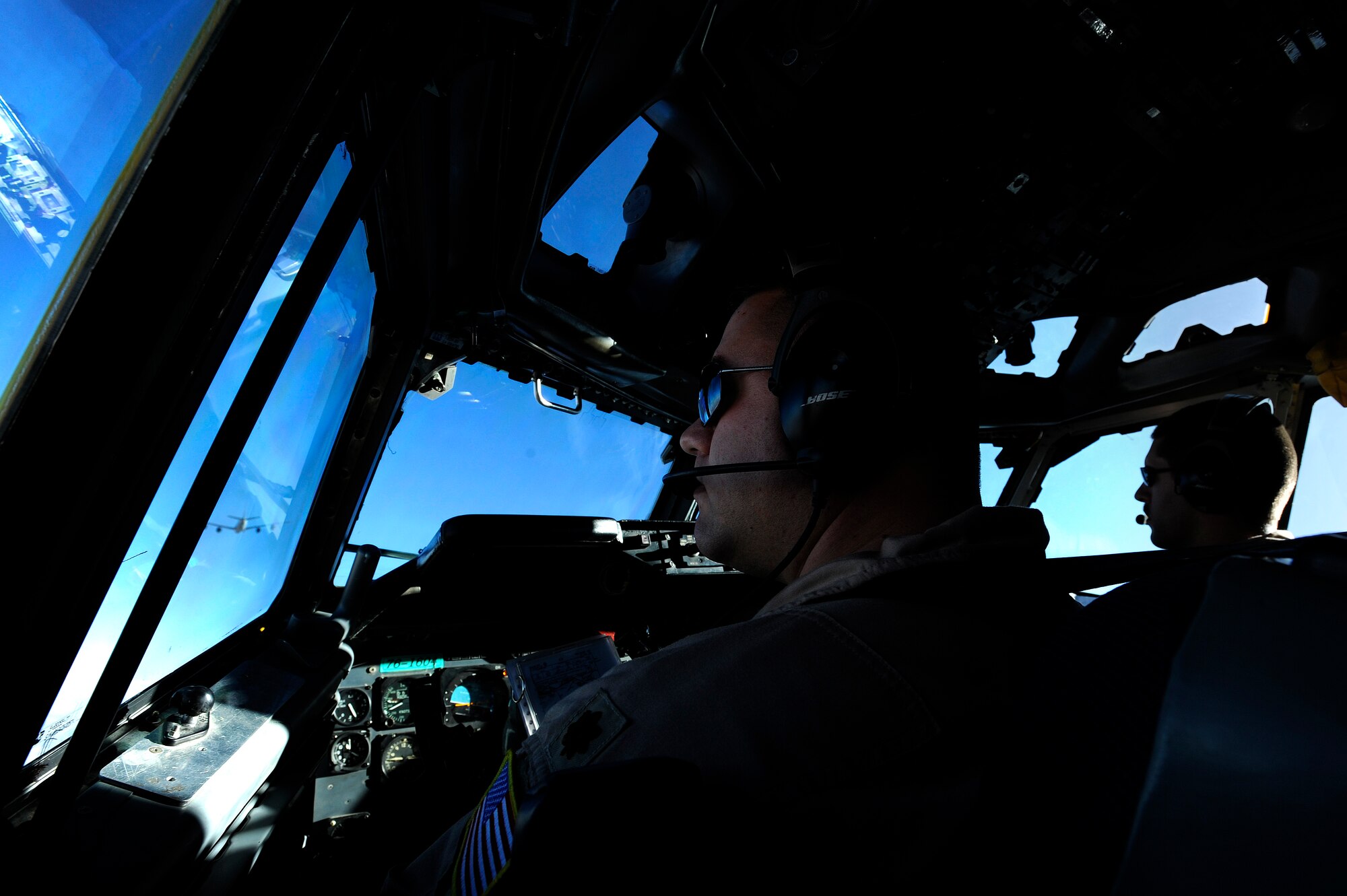 A U.S. Air Force E-3 Sentry flight crew, from the 960th Expeditionary Airborne Air Control Squadron, approach a KC-135R Stratotanker to refuel during an Airborne Warning and Control System mission over Afghanistan, Oct. 8, 2009.  (U.S. Air Force photo by Staff Sgt. Michael B. Keller) (Released)

