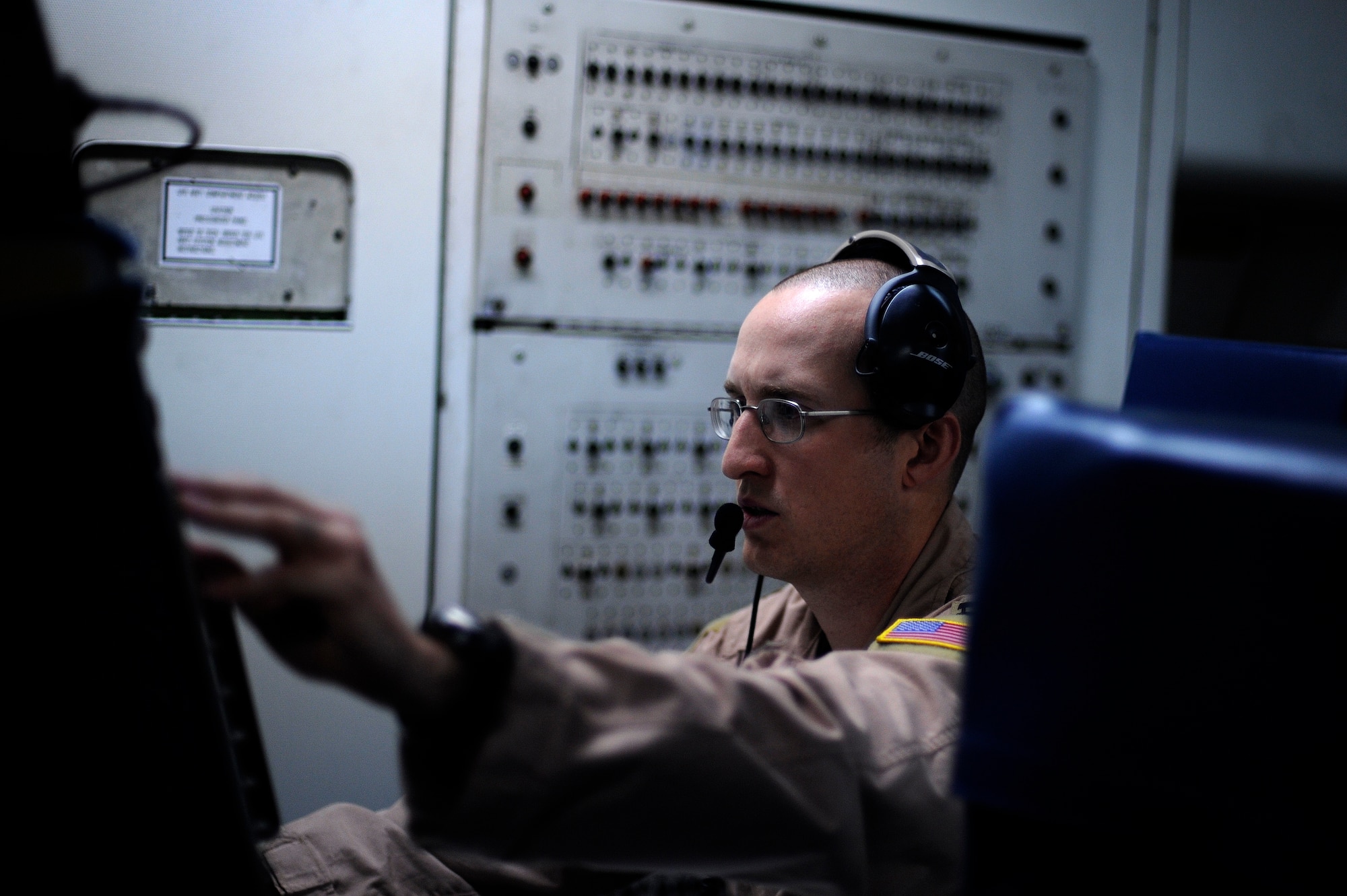 U.S. Air Force Capt. Ron Cooper Jr., from the 960th Expeditionary Airborne Air Control Squadron, manages air assets on an E-3 Sentry Airborne Warning and Control System mission over Afghanistan, Oct. 8, 2009.  (U.S. Air Force photo by Staff Sgt. Michael B. Keller) (Released)

