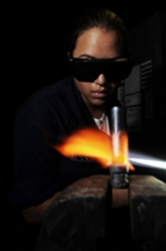 U.S. Navy Seaman Gillian Jackson brazes a pipe in the welding shop aboard the aircraft carrier USS Nimitz (CVN 68) while the ship is underway in the Indian Ocean on Oct. 17, 2009.  The Nimitz Carrier Strike Group is on deployment to the U.S. 5th Fleet area of operations.  