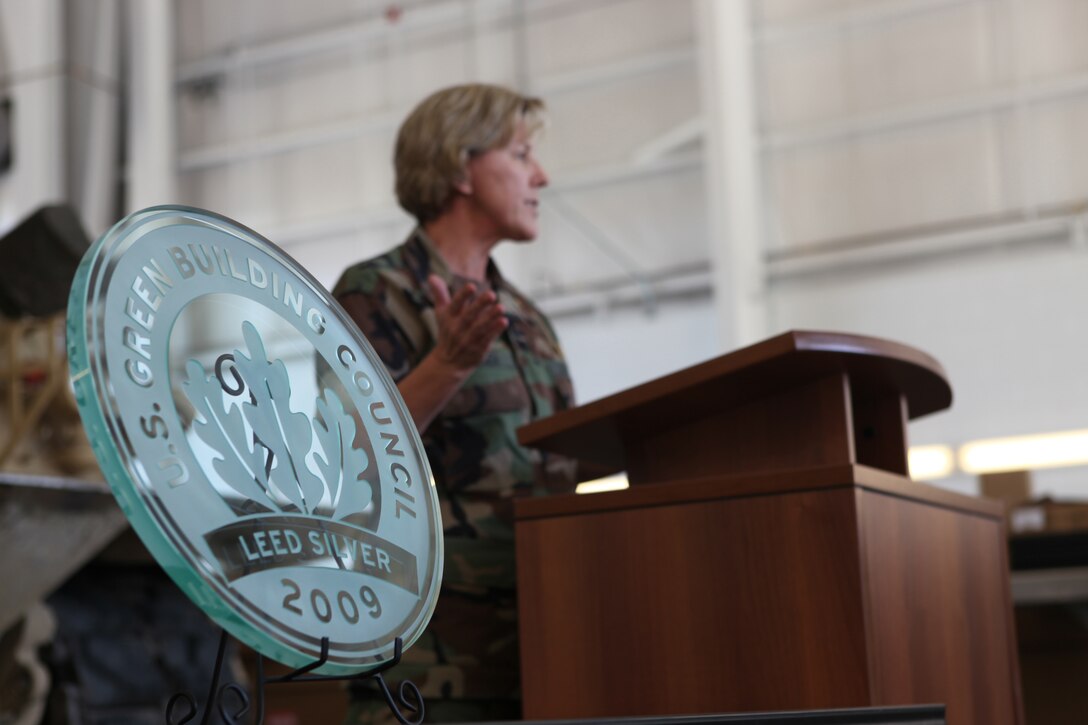 Cmdr. Cheryl Hansen, Officer in Charge of Construction for Marine Corps Installations – East, spoke during the ceremony in regards to Marine Corps Base Camp Lejeune achieving the Leadership in Energy and Environmental Design Silver certification for the building of SR-72, Reserve Training Center and Tank Maintenance Facility in the Greater Sandy Run area.