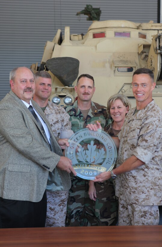 Kevin McBride, vice president for N.C. VIRTEXCO Corp., Col. William P. Davis, Assistant Chief of Staff for Facilities, Marine Forces Reserve, Cmdr. Cheryl Hansen, Officer in Charge of Construction for Marine Corps Installations – East, and Col. Richard P. Flatau Jr., the commanding officer for Marine Corps Base Camp Lejeune, recently received the Leadership in Energy and Environmental Design Silver certification ceremony, for the building of SR-72, Reserve Training Center and Tank Maintenance Facility in the Greater Sandy Run area. Flatau said it was an honor for Lejeune to receive this award and lead the example with this achievement.