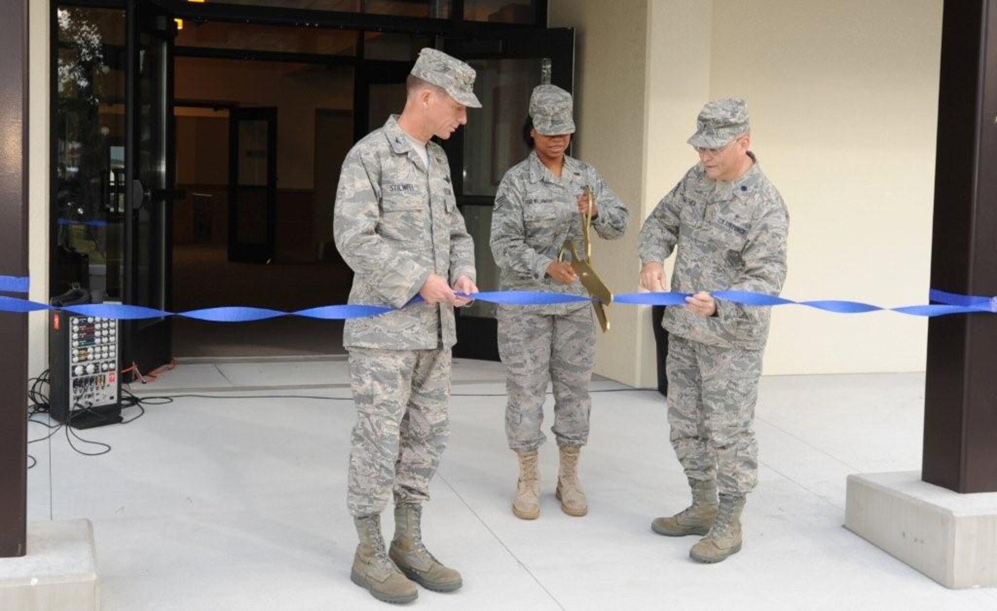 MISAWA AIR BASE, Japan – Col. David Stilwell (left), 35th Fighter Wing commander, and Lt. Col. Jerry Sather (right), 35th FW chaplain, hold the ribbon while Staff Sgt. Tabitha David-Williamson, 35th FW chaplain assistant, cuts the ribbon Oct. 22 to mark the reopening of the base chapel. More than $3 million went toward improvements. (U.S. Air Force photo/Senior Airman Jamal D. Sutter)