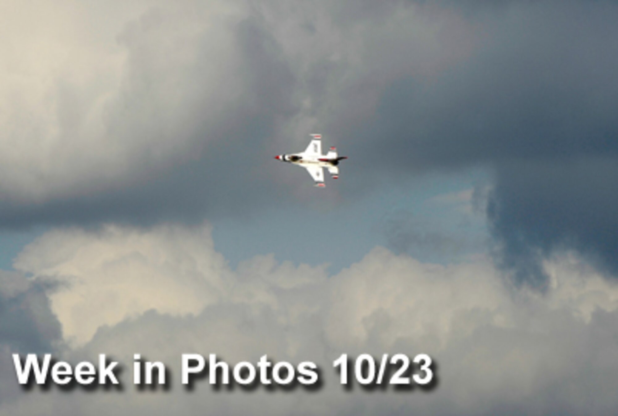 Air Force Week in Photos for Oct. 23 highlights photos from around the Air Force. In this photo by Staff Sgt. Brian Ferguson, an Air Force Thunderbird F-16 flies over Osan Air Base, South Korea, Oct. 19, 2009, in preparation for the base Airpower Day air show. (U.S. Air Force illustration)
