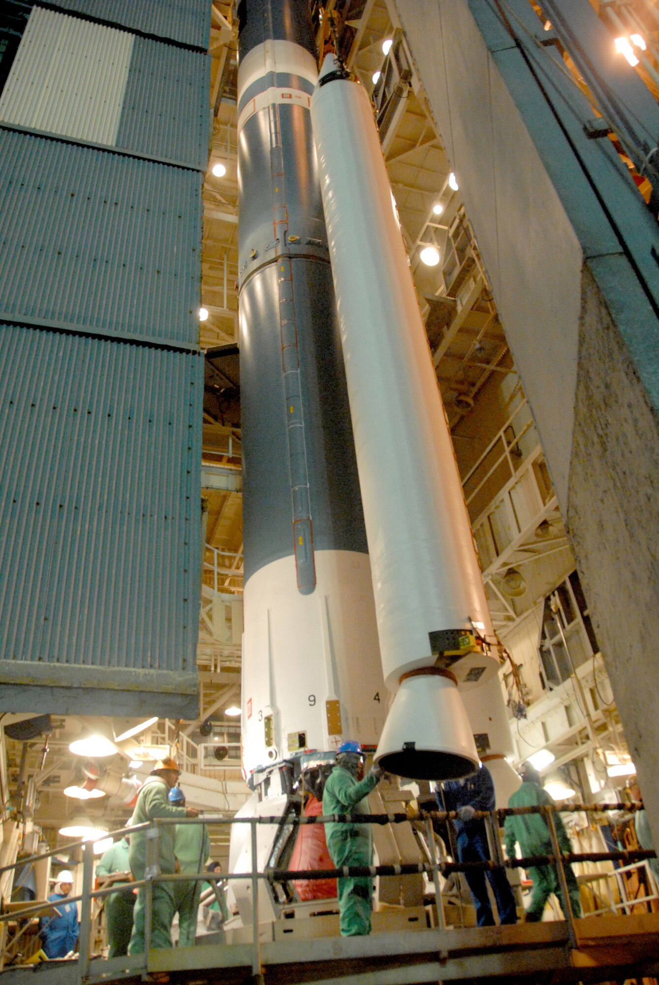 VANDENBERG AIR FORCE BASE, Calif. --  United Luanch Alliance workers position a solid rocket motor for emplacement on a Delta II rocket. The Delta II rocket will launch NASA's Wide-field Infrared Survey Explorer satellite, which will observe the entire sky in mid-infrared wavelengths with greater sensitivity than ever before. (Courtesy photo/Mark P. Mackley)