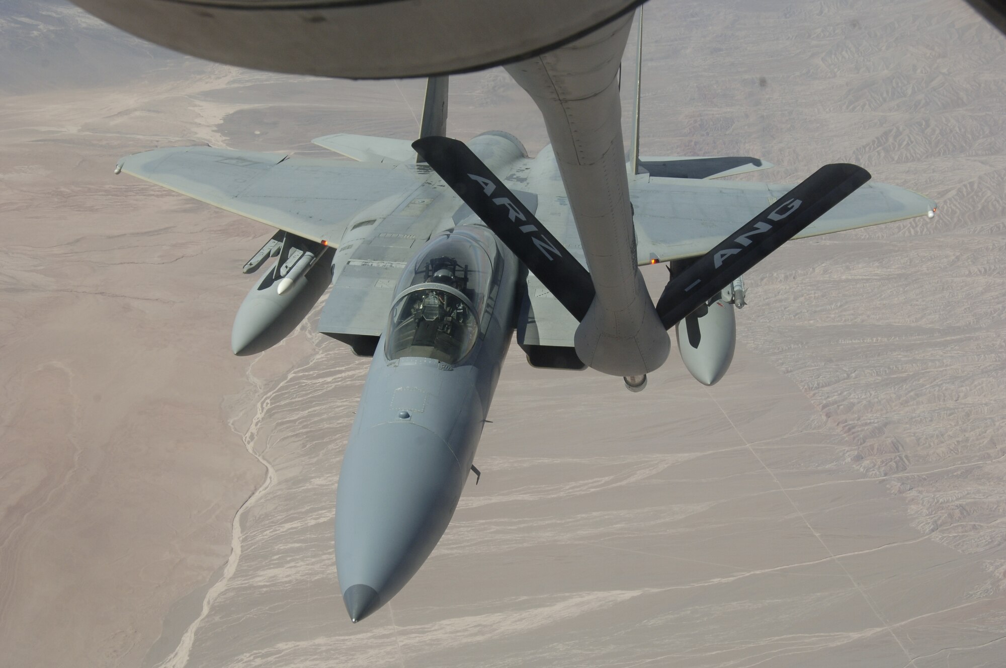 IQUIQUE, Chile – An F-15 with the 159th Fighter Wing approaches the boom of a KC-135 Stratotanker during a refueling mission Oct. 22. The Fuerza Aérea de Chile or FACh hosted the United States, Brazil, Argentina, and France during Exercise SALITRE II, a multinational exercise focused on interoperability. (U.S. Air Force photo by Tech. Sgt. Eric Petosky)