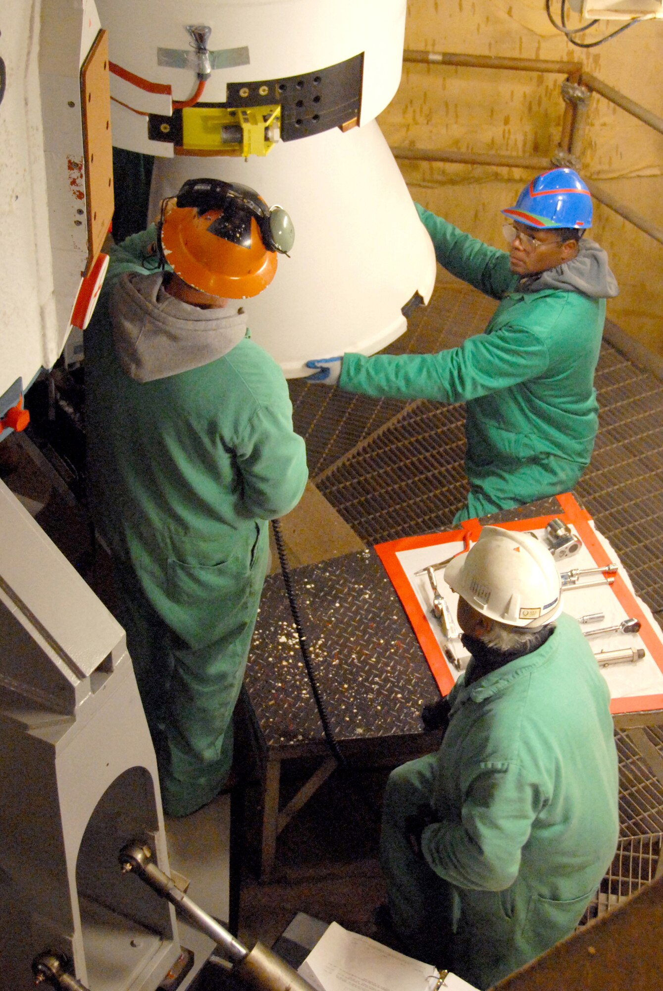 VANDENBERG AIR FORCE BASE, Calif. --  United Luanch Alliance workers place a solid rocket motor on a Delta II rocket. The Delta II rocket will launch NASA's Wide-field Infrared Survey Explorer satellite, which will observe the entire sky in mid-infrared wavelengths with greater sensitivity than ever before. (Courtesy photo/Mark P. Mackley)