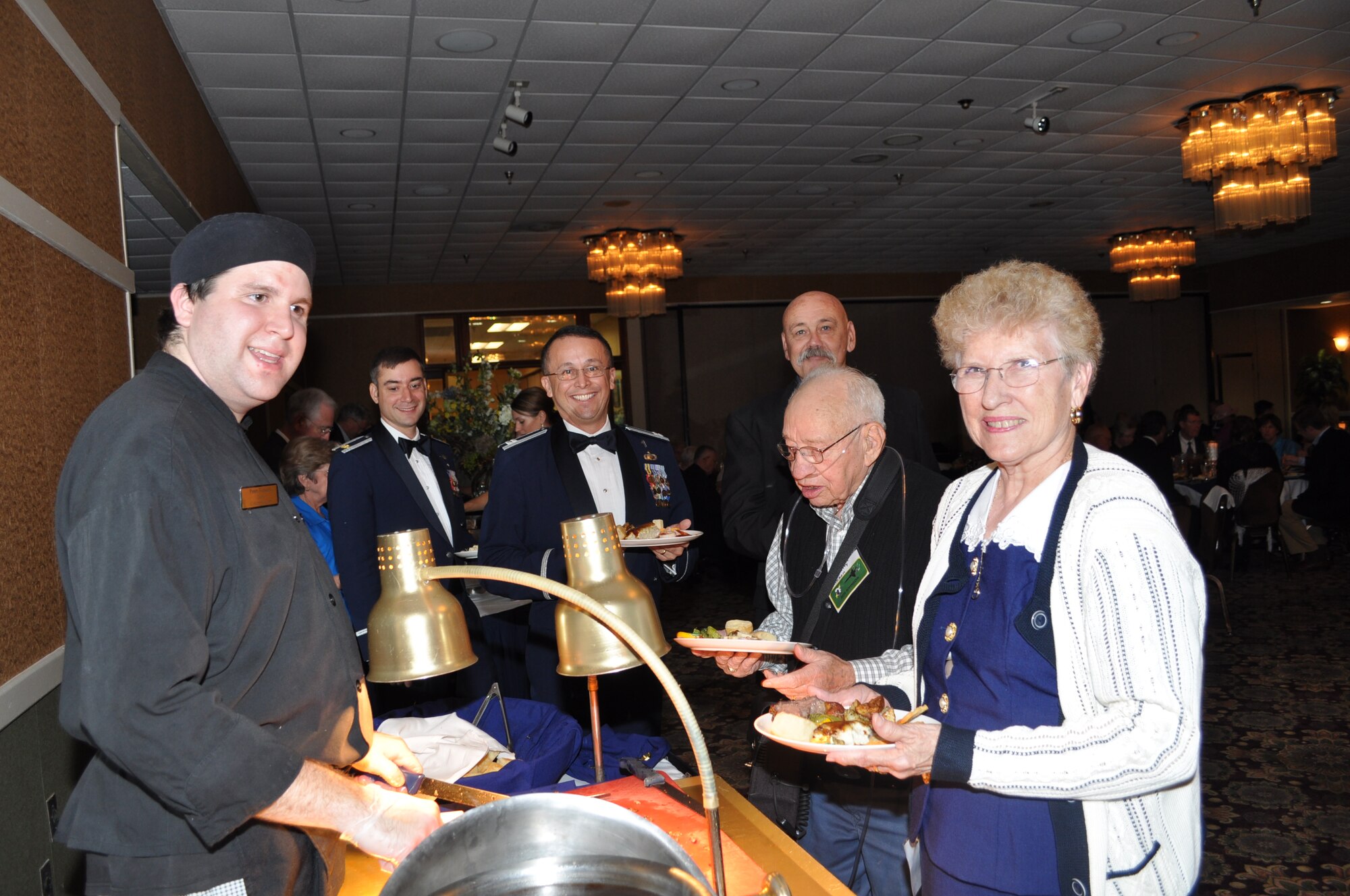 The buffet line at the 49th Fighter Squadron Association banquet at the Columbus Club. (U.S. Air Force photo/Sonic Johnson).