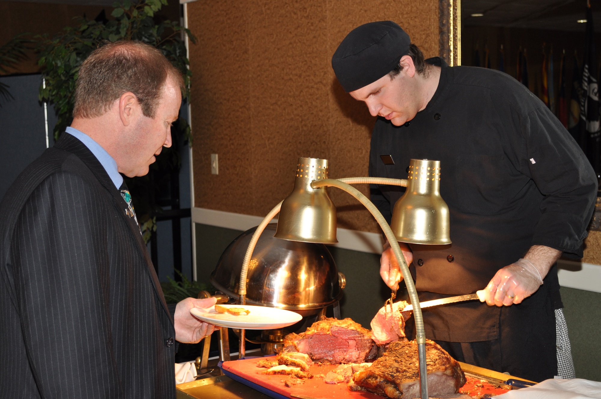 The buffet line at the 49th Fighter Squadron Association banquet at the Columbus Club. (U.S. Air Force photo/Sonic Johnson).