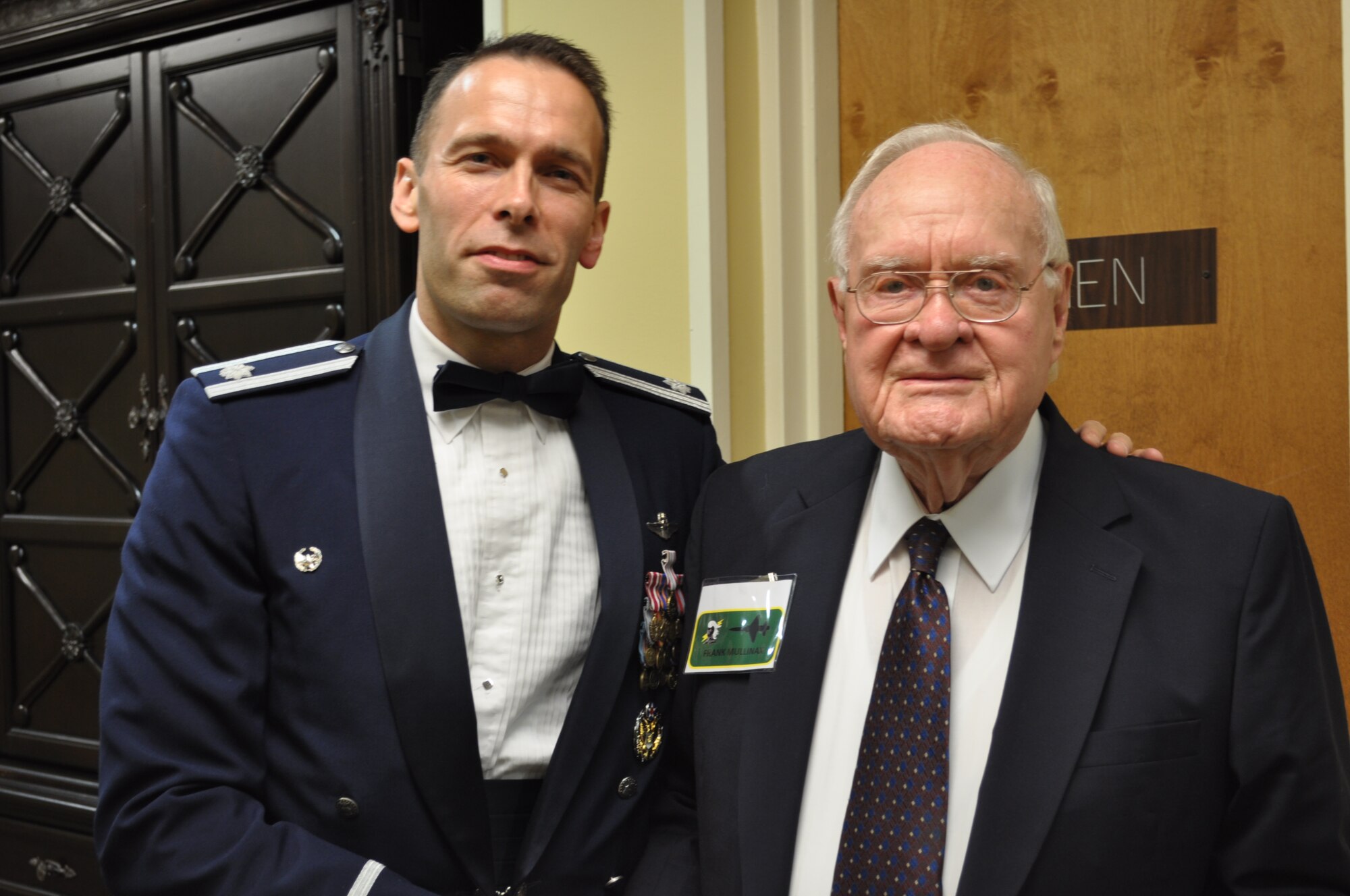 Lt. Col. Tor Dietrichs, 49th Fighter Training Squadron Commander, stands with Mr. Frank Mullinax, 49th WWII P-38 pilot and former POW, during the 49th Fighter Squadron Association banquet at the Columbus Club. (U.S. Air Force photo/Sonic Johnson).
