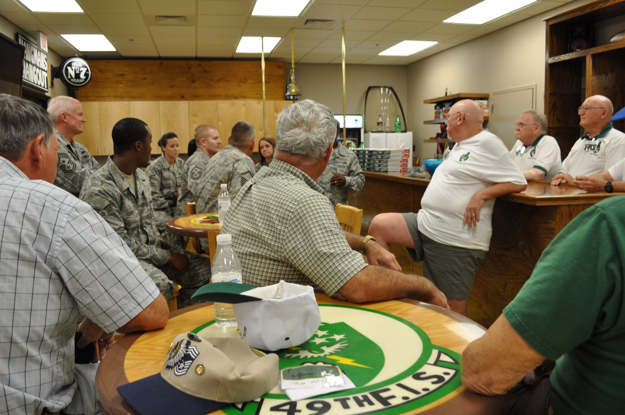 Enlisted members of Columbus AFB chat with prior enlisted members of the 49th Fighter Squadron Association. (U.S. Air Force photo/Sonic Johnson).