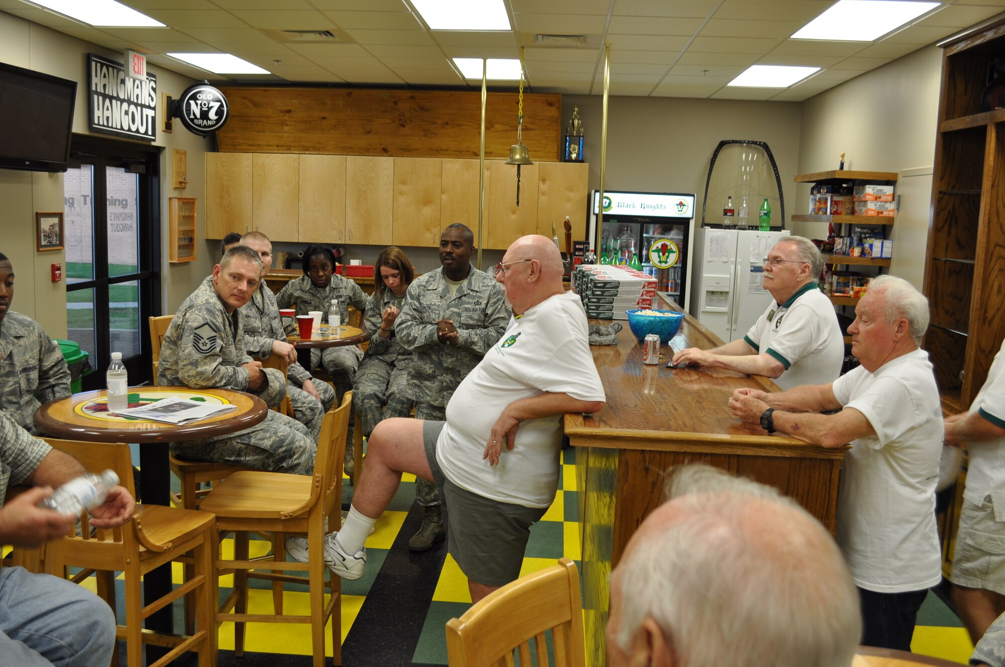 Enlisted members of Columbus AFB chat with prior enlisted members of the 49th Fighter Squadron Association. (U.S. Air Force photo/Sonic Johnson).