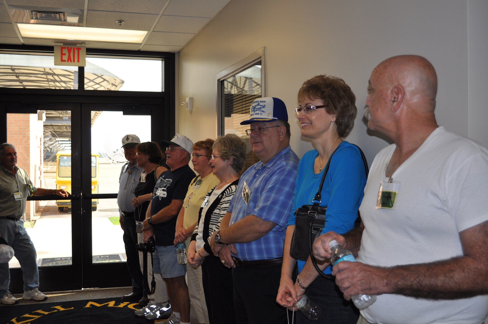 Members of the 49th Fighter Squadron Association tour the 49th Fighter Training Squadron Heritage Hall during their reunion. (U.S. Air Force photo/Sonic Johnson).