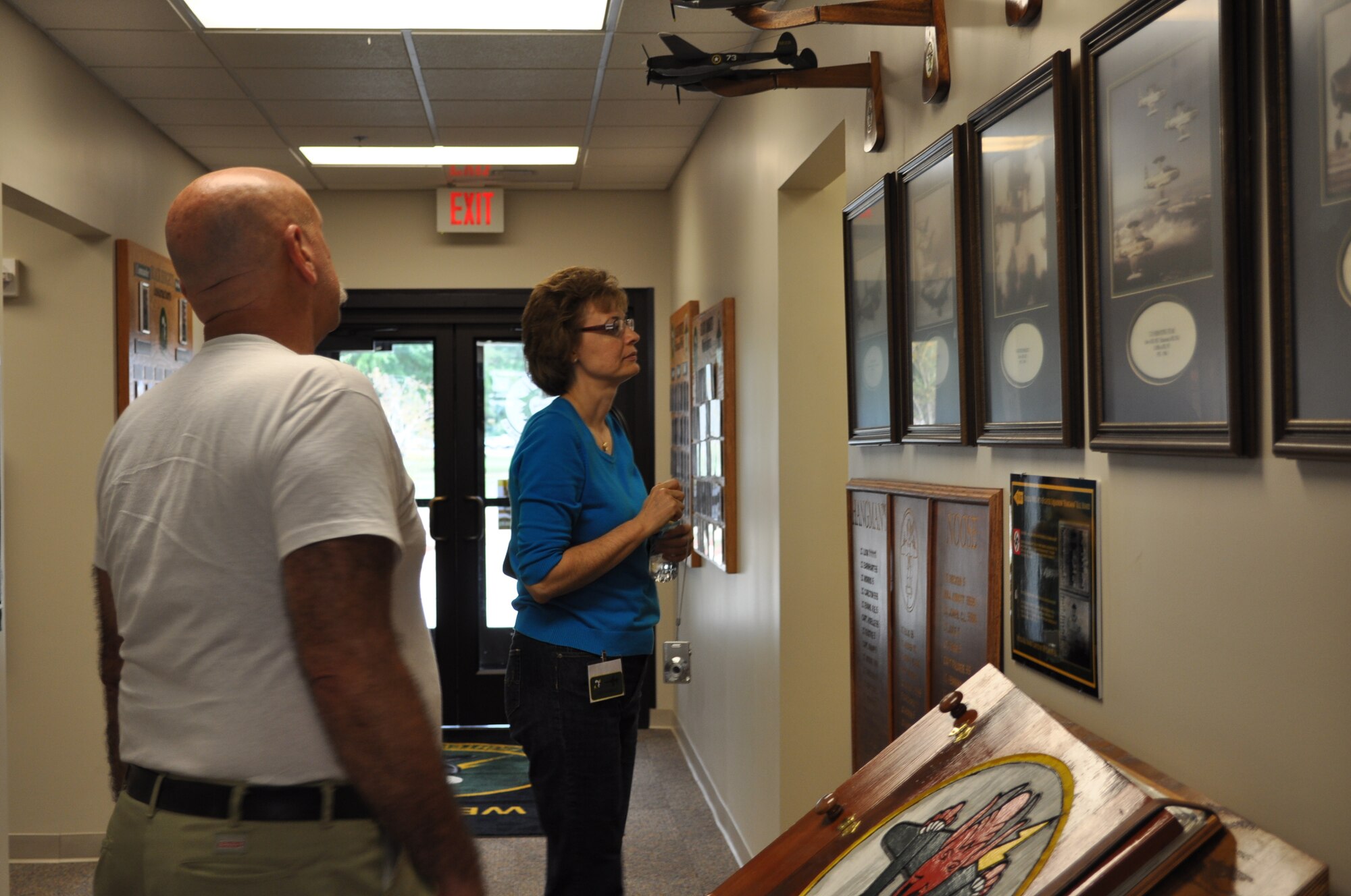 Members of the 49th Fighter Squadron Association tour the 49th Fighter Training Squadron Heritage Hall during their reunion. (U.S. Air Force photo/Sonic Johnson).