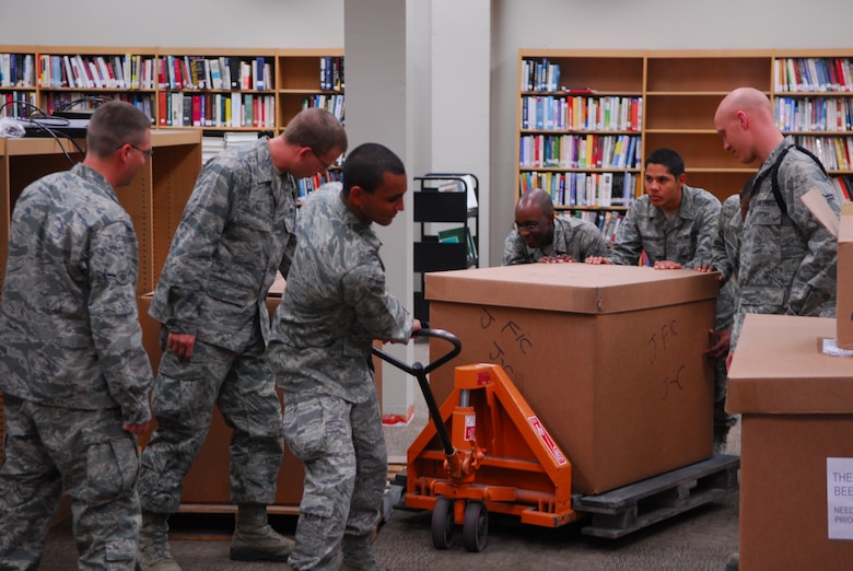 VANDENBERG AIR FORCE BASE, Calif. – Airmen from the 381st Training Group, 532nd and 533rd Training Squadrons, help in the renovation of the base library by moving boxes of books in the library Wednesday, Oct. 21, 2009. Airmen from Vandenberg’s training squadrons frequently volunteer in the local community. (U.S. Air Force photo/Airman 1st Class Steve Bauer)