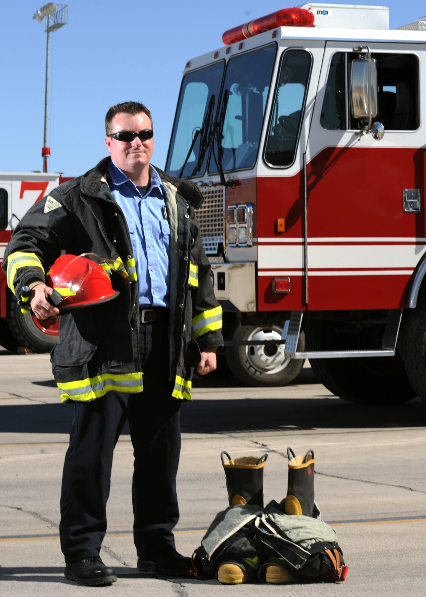 CREECH AIR FORCE BASE, Nev.-- Bradley Myers, 99th Civil Engineering Squadron lead firefighter, poses in front of his fire truck at Creech. Mr. Myers was selected as the 2008 Department of Defense Civilian Firefighter of the Year during a National Fire Chiefs Conference Ceremony in Dallas Aug. 28. (U.S. Air Force photo by Tech. Sgt. Mike Holzworth)
