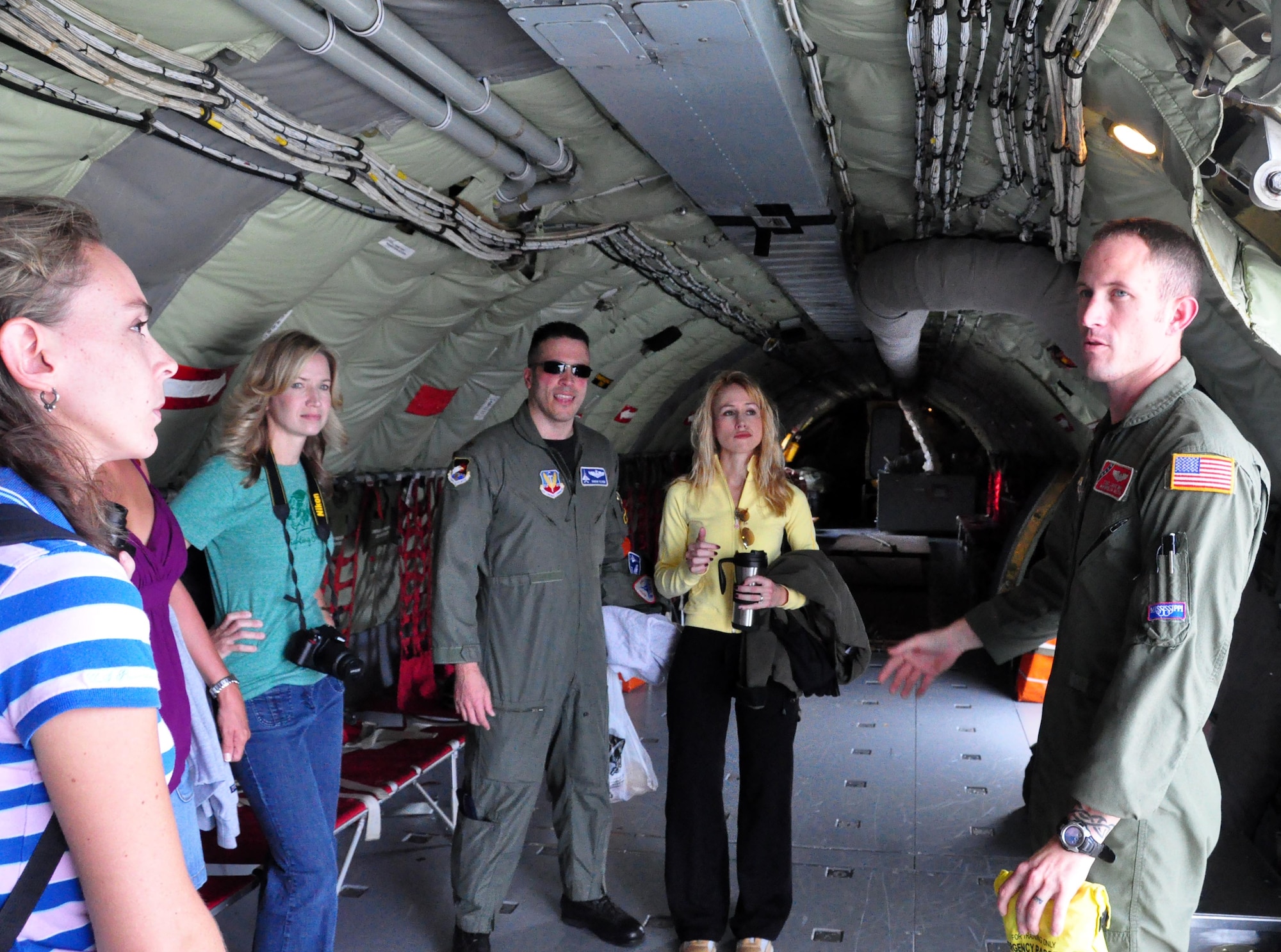 Tech Sgt. Jake Way, 153rd Air Refueling Squadron boom operator, gives a safety brief to the wives of the 2nd Fighter Squadron pilots. (U.S. Air Force photo by Airman 1st Class Rachelle Elsea)