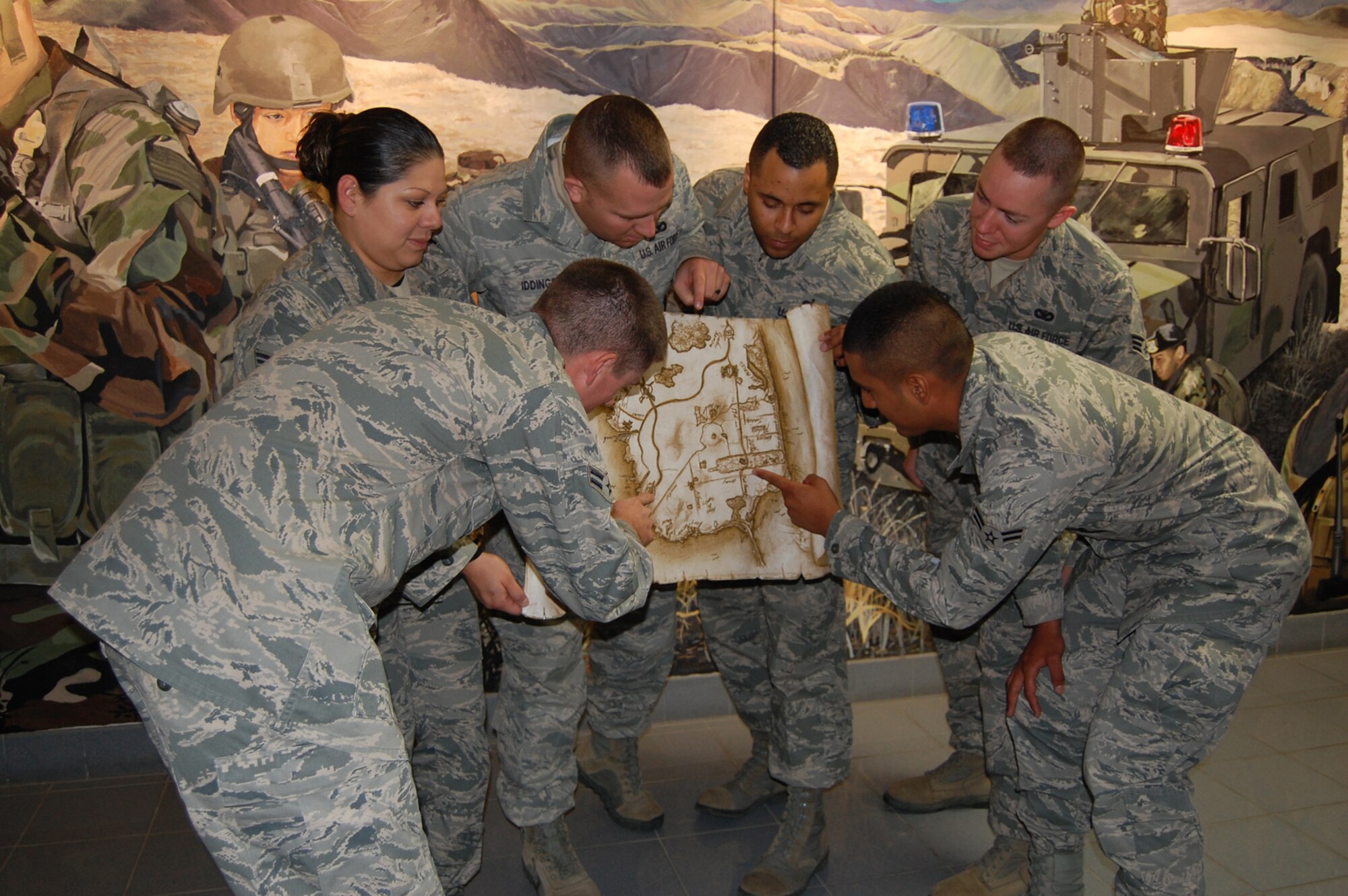 Members of the 741st Missile Security Forces Squadron get into practice for the scavenger hunt planned for Nov. 25 and 26. The event is one of six Operation Holiday Cheer events open to all active-duty members at Malmstrom and offers cash prizes -- $300, $200 and $100 respectively -- to the top three finishers. Anyone who competes in an event is eligible to win the grand prize, two round-trip airline tickets to anywhere in the United States that will be given away at the wrap-up party Dec. 17. For complete details, visit www.341fss.com. (U.S. Air Force photo/Valerie Mullett)