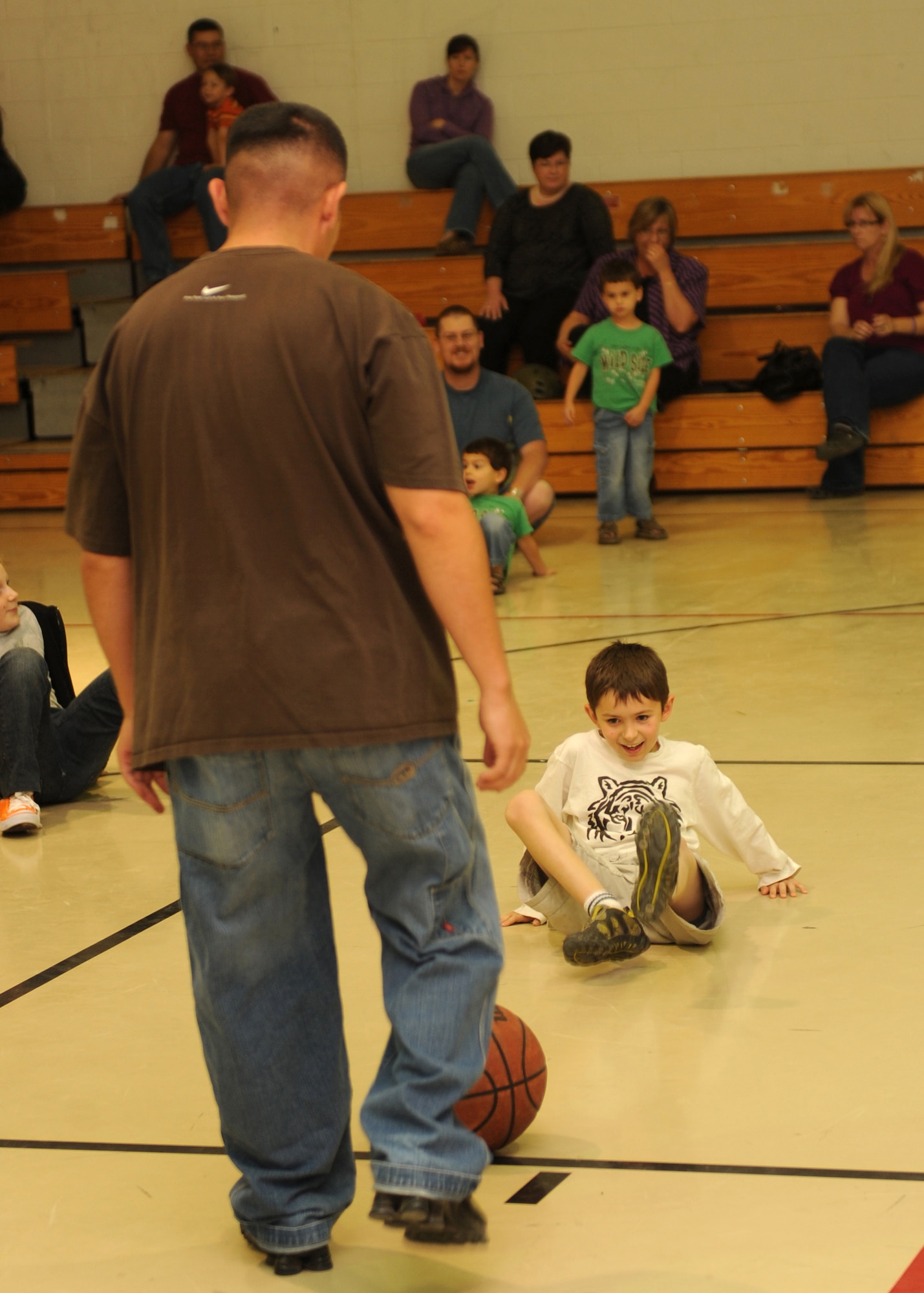 HOLLOMAN AIR FORCE BASE, N.M. -- A Holloman youth uses a basketball to simulate kicking away a person to prevent an abduction in a child self-defense class held here Oct. 21. The Sexual Assualt Prevention Response office hosted the class on self-defense that covered aspects of personal protection unique to children at the Youth and Teen Center. The class covered techniques to prevent abduction and escape plans with the help of Overstreet Taekwondo. (U.S. Air Force photo by Senior Airman Michael Means)