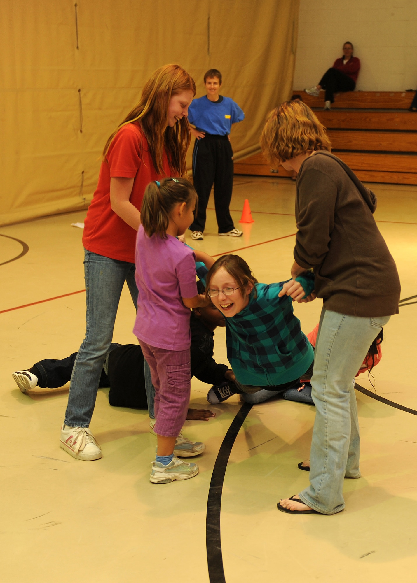 HOLLOMAN AIR FORCE BASE, N.M. -- Children learn to work together by holding on to each other to prevent them from being abducted during a self-defense class held here Oct. 21. The Sexual Assualt Prevention Response office hosted the class that covered aspects of personal protection unique to children at the Youth and Teen Center. The class covered techniques to prevent abduction and escape plans with the help of Overstreet Taekwondo. Children had fun while learning numerous self-defense techniques. (U.S. Air Force photo by Senior Airman Michael Means)