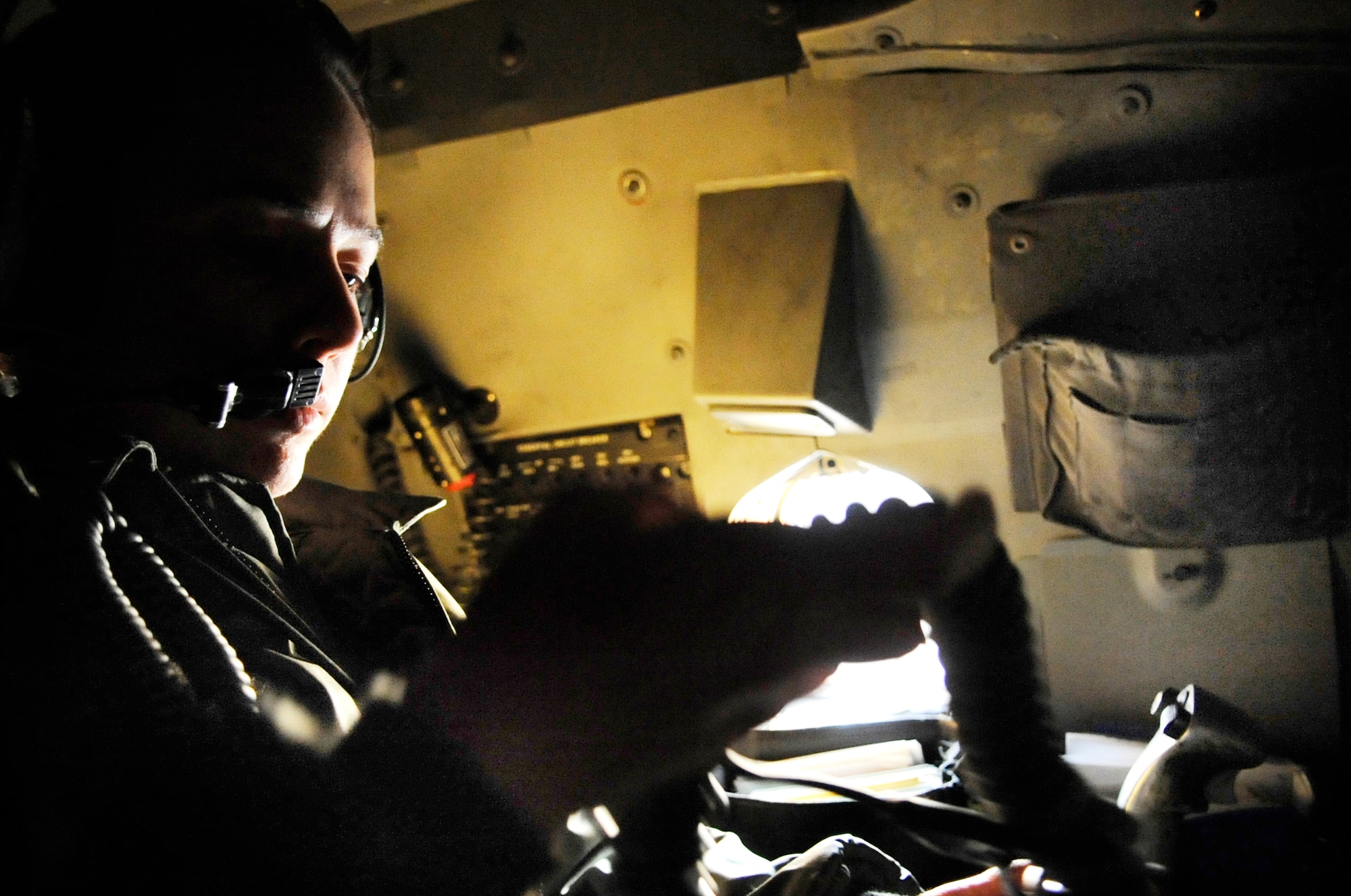 Capt. Kaylene Giri, a 34th Bomb Squadron weapons systems officer instructor at Ellsworth Air Force Base, S.D., proceeds through a preflight checklist at her WSO crew station in a B-1B Lancer Oct. 15, 2009. Capt. Giri, along with another WSO and the two pilots, perform pre-flight checks to ensure all systems are functioning before every mission. (U.S. Air Force photo/Airman 1st Class Corey Hook)