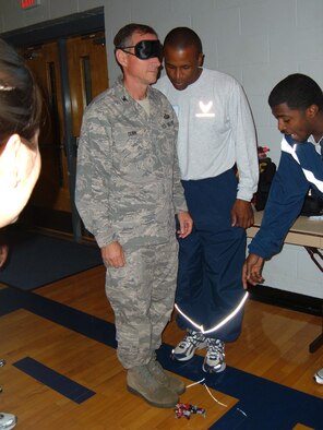 Col. Charles Dunn, 43rd Mission Support Group Commander, participates in Wingman Day activities with the 2nd Airlift Squadron Oct. 16. The day featured briefings on DUI ramifications, the dangers of texting while driving and the importance of suicide prevention. The day concluded with a small group break out session in which Team Pope discussed topics such as stress management and conflict resolution. (U.S. Air Force Photo Courtesy)