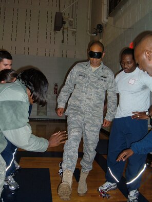 Col. James Johnson, 43rd Airlift Wing Commander, participates in Wingman Day activities with the 2nd Airlift Squadron Oct. 16. The day featured briefings on DUI ramifications, the dangers of texting while driving and the importance of suicide prevention. The day concluded with a small group break out session in which Team Pope discussed topics such as stress management and conflict resolution. (U.S. Air Force Photo Courtesy)