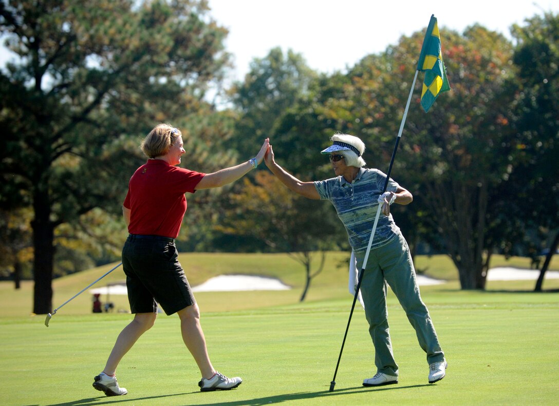 LANGLEY AIR FORCE BASE, Va. - Retired Maj, Jayne Errington, British Army Ladies Golf Team member, and Sachiko Delaney, Eaglewood Women's Golf Association member, during the match here Oct. 21. The team tours biennially; this year the team competed at three Virginia military installations. (U.S. Air Force photo/ Senior Airman Dana Hill)