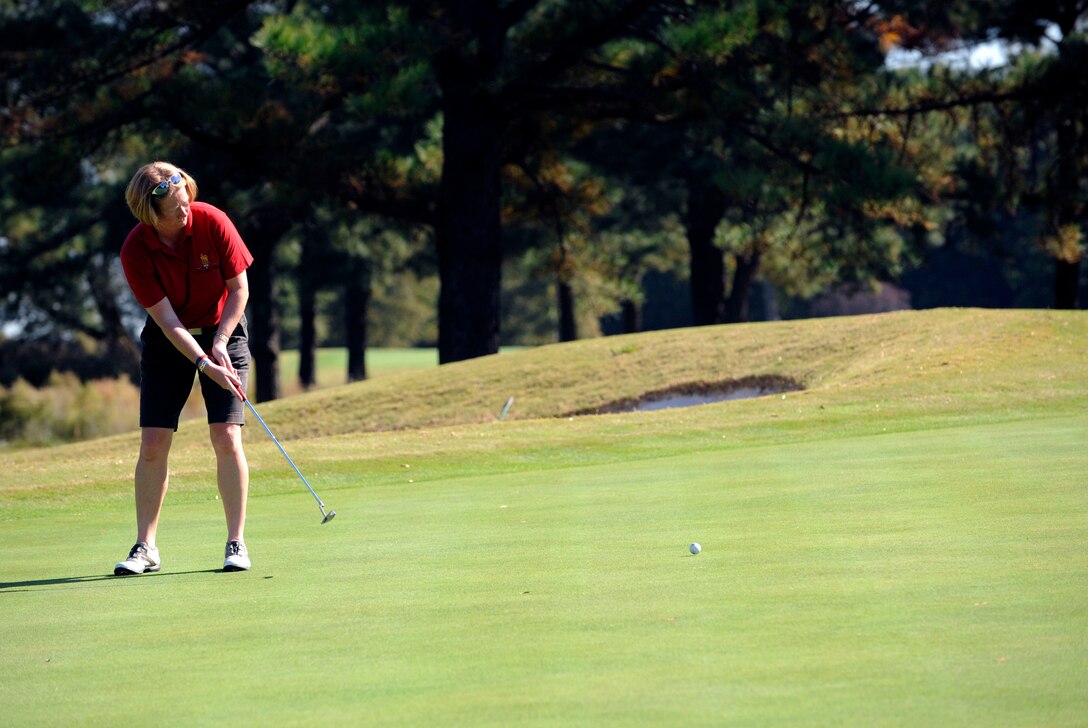 LANGLEY AIR FORCE BASE, Va. - Retired Maj. Jayne Errington, British Army Ladies Golf Team member, makes a half shot on the green during the match here Oct. 21. The team tours biennially; this year the team competed at three Virginia military installations. (U.S. Air Force photo/ Senior Airman Dana Hill)