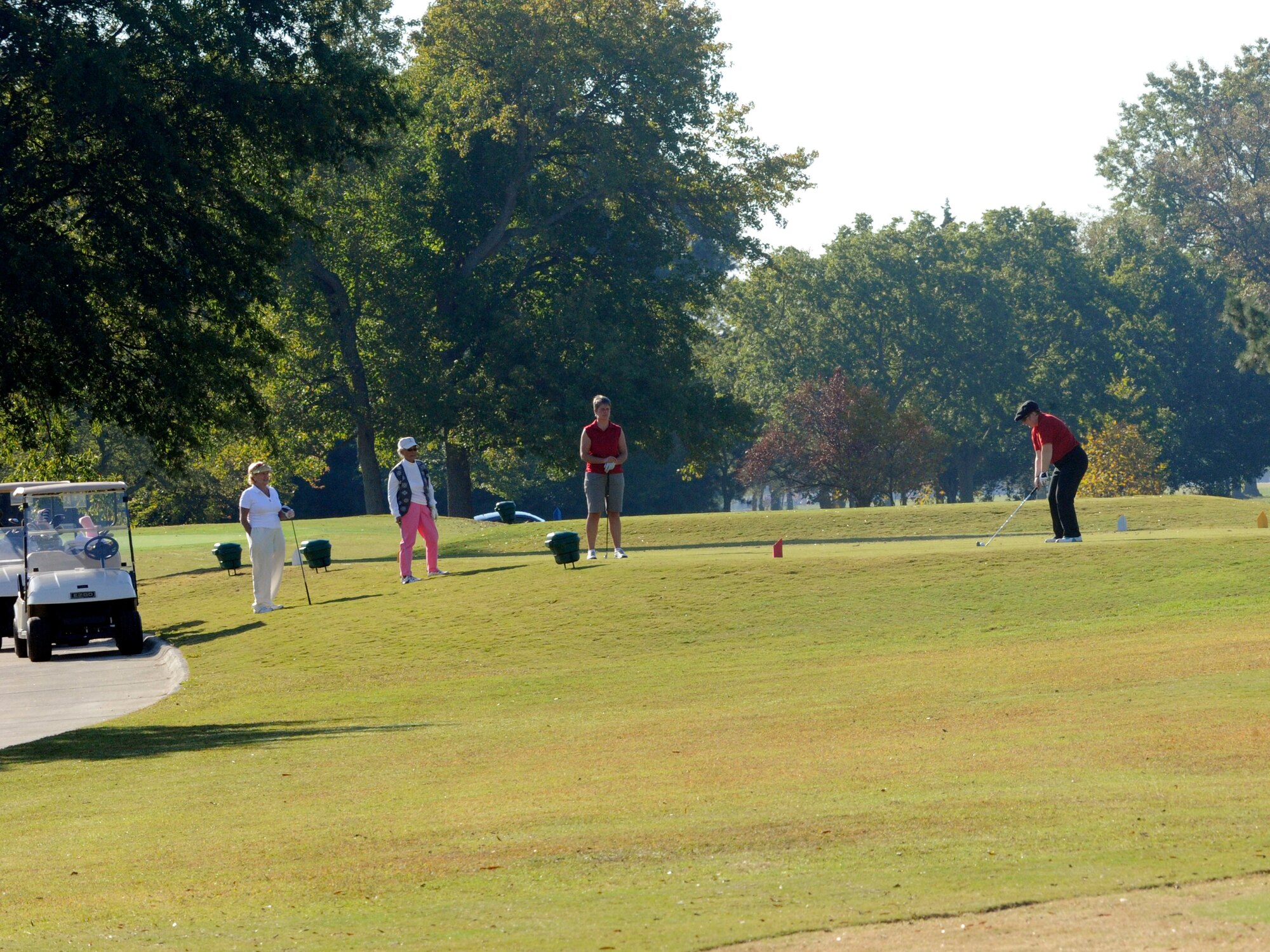 LANGLEY AIR FORCE BASE, Va. - Members from the British Army Ladies Golf Team and the Eaglewood Women's Golf Association tee off during the match here Oct. 21. The team tours biennially; this year the team competed at three Virginia military installations. (U.S. Air Force photo/ Senior Airman Dana Hill)

