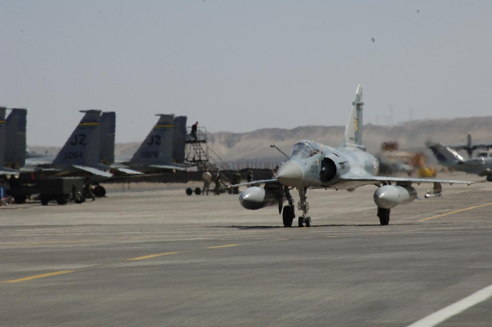 ANTOFAGASTA, Chile – A French Mirage taxis past U.S. F-15s from the
159th Fighter Wing Oct. 23 during Exercise SALITRE II hosted by Chile.
(U.S. Air Force photo by Tech. Sgt. Eric Petosky)