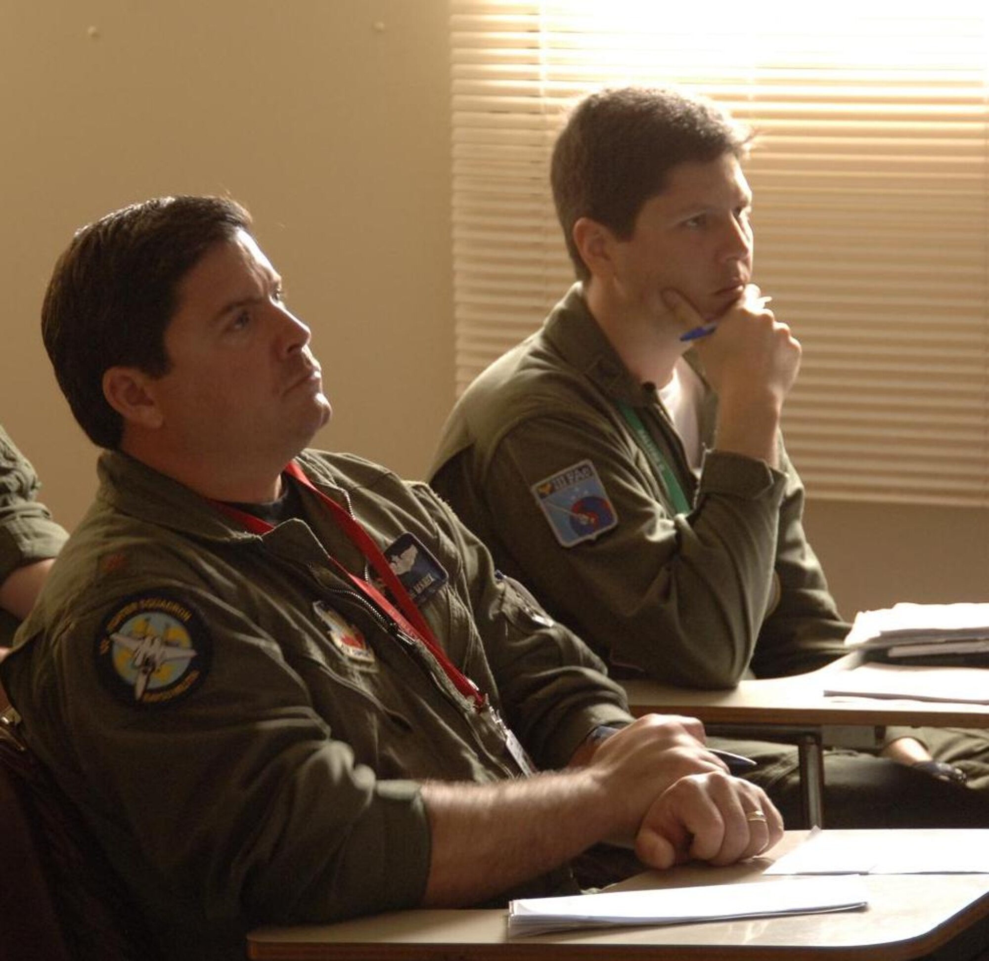 ANTOFAGASTA, Chile – Maj. John Manix, an F-15
pilot with the 159th Fighter Wing, and Capt. Daniel Manso, an A-1
pilot for the Brazilian Air Force, attend a briefing before flying in
a dissimilar aircraft formation during Exercise SALITRE II hosted by
Chile. The United State’s F-15, Brazil’s A-1, Chile’s F-16,
Argentina’s A-4 and France’s Mirage flew the formation Oct. 23. (U.S.
Air Force photo by Tech. Sgt. Eric Petosky))
