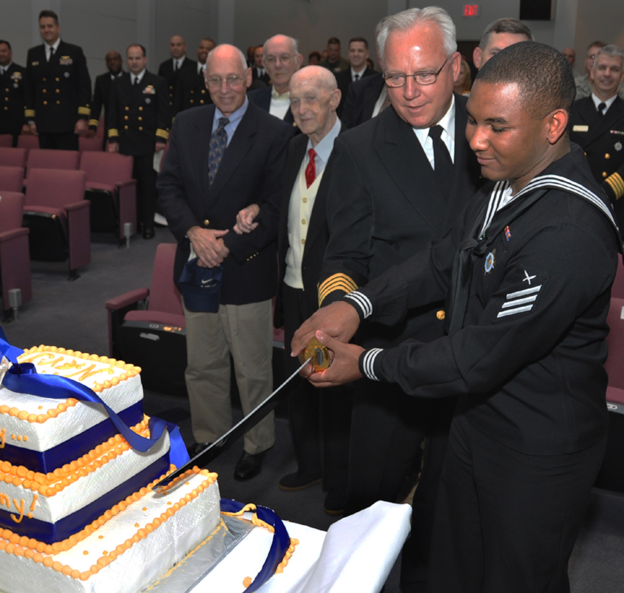 SCOTT AIR FORCE BASE, Ill., -- The oldest and youngest members of the U.S Navy stationed at the U.S. Transportation Command cut a  cake Oct. 16 commemorating the Navy's 234th birthday. They are Capt. Michael Murray and Seaman Patrick Moore.
U.S. Air Force photo/ Bob Fehringer