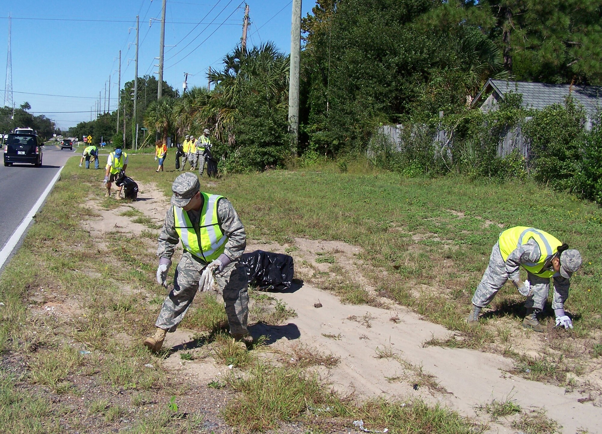 FORT WALTON BEACH, Fla. - Members of the 505th Command and Control Wing pick up debris from the side of James Lee Road on Oct. 16. The 505th CCW adopted the road in the Adopt-A-County Road program and comes out every few months to keep it clean. (U.S. Air Force photo by Noel Getlin) 