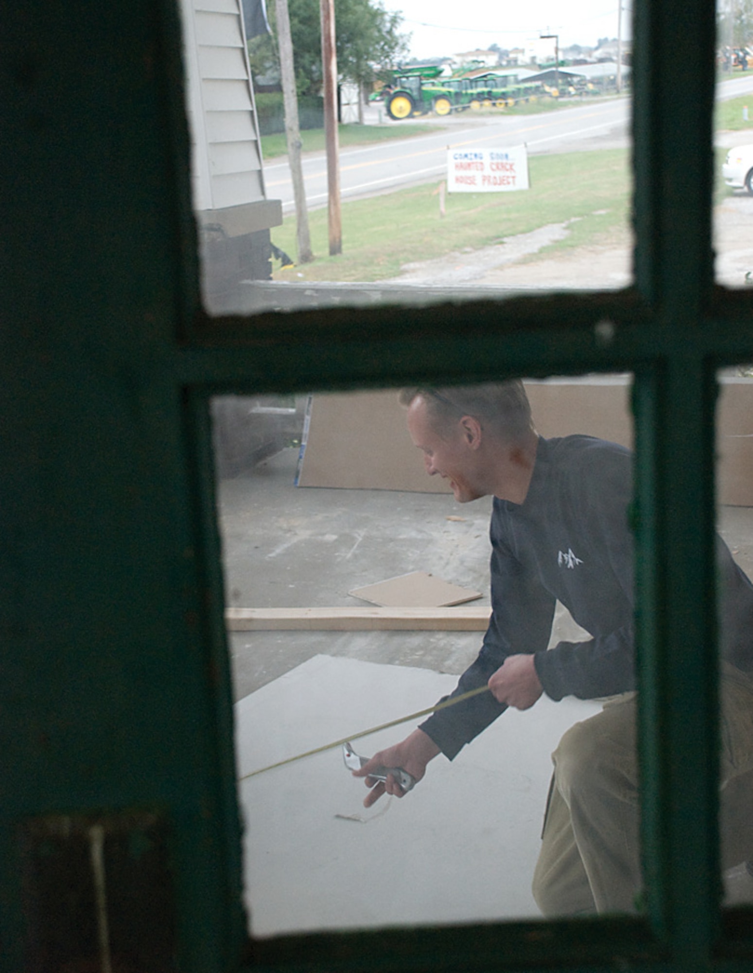 SCOTT AIR FORCE BASE, Ill., -- Tech. Sgt. John Arensmeyer measures dry-wall Oct. 15 to be used for partitions inside the Haunted Crack House.
U.S. Air Force photo/ Steve Berry