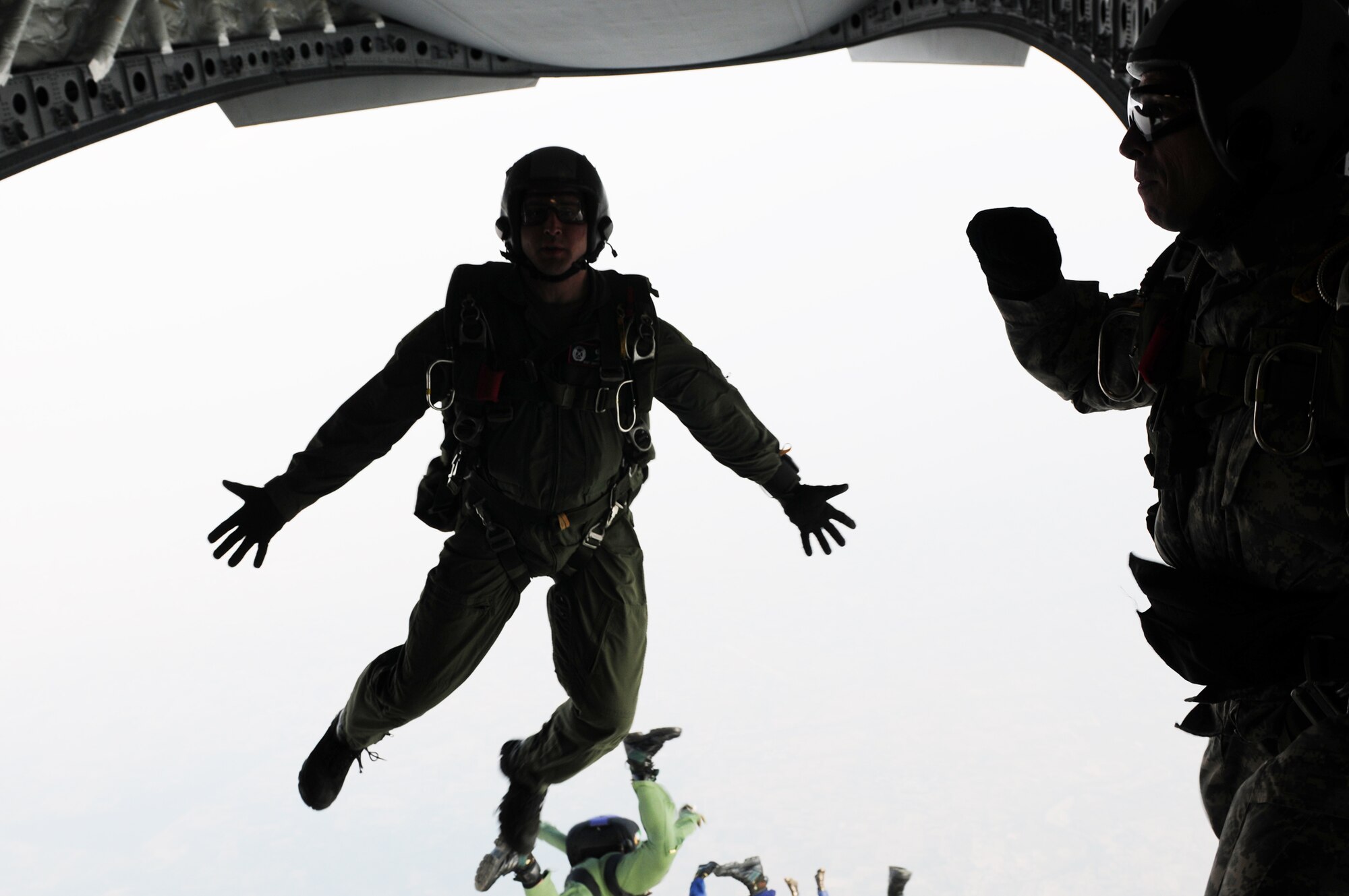 An Airmen assigned to the 353rd Combat Training Squadron jumps out of a C-17 Globemaster III during the first ever combined high-altitude low-opening mission with the United States and Indian air forces at Air Force Station Agra, India, )ct. 19, 2009. More than 150 U.S. Air Force and Army personnel are deployed to India for Cope India, a humanitarian assistance disaster relief exercise. (U.S. Air Force photo/Capt. Genieve David)