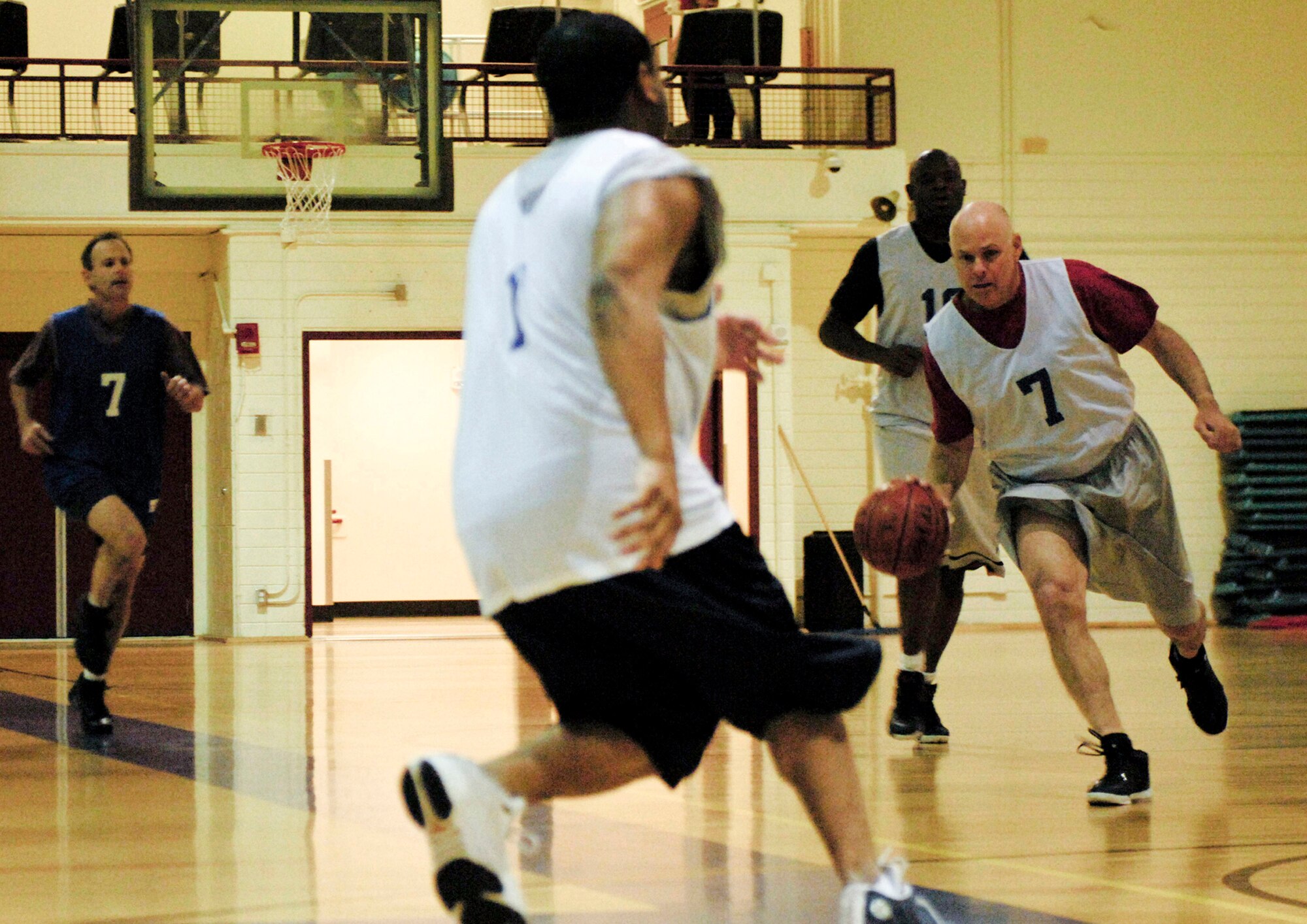 ELMENDORF AIR FORCE BASE, Alaska -- Martin Page, 3rd Civil Engineer Squadron, dribbles down the court looking for an open man during an over 30 year-old league game Oct. 21. The 3rd CES beat the Army Corps of Engineers 73-55. (U.S. Air Force photo/Airman 1st Class Christopher Gross) 