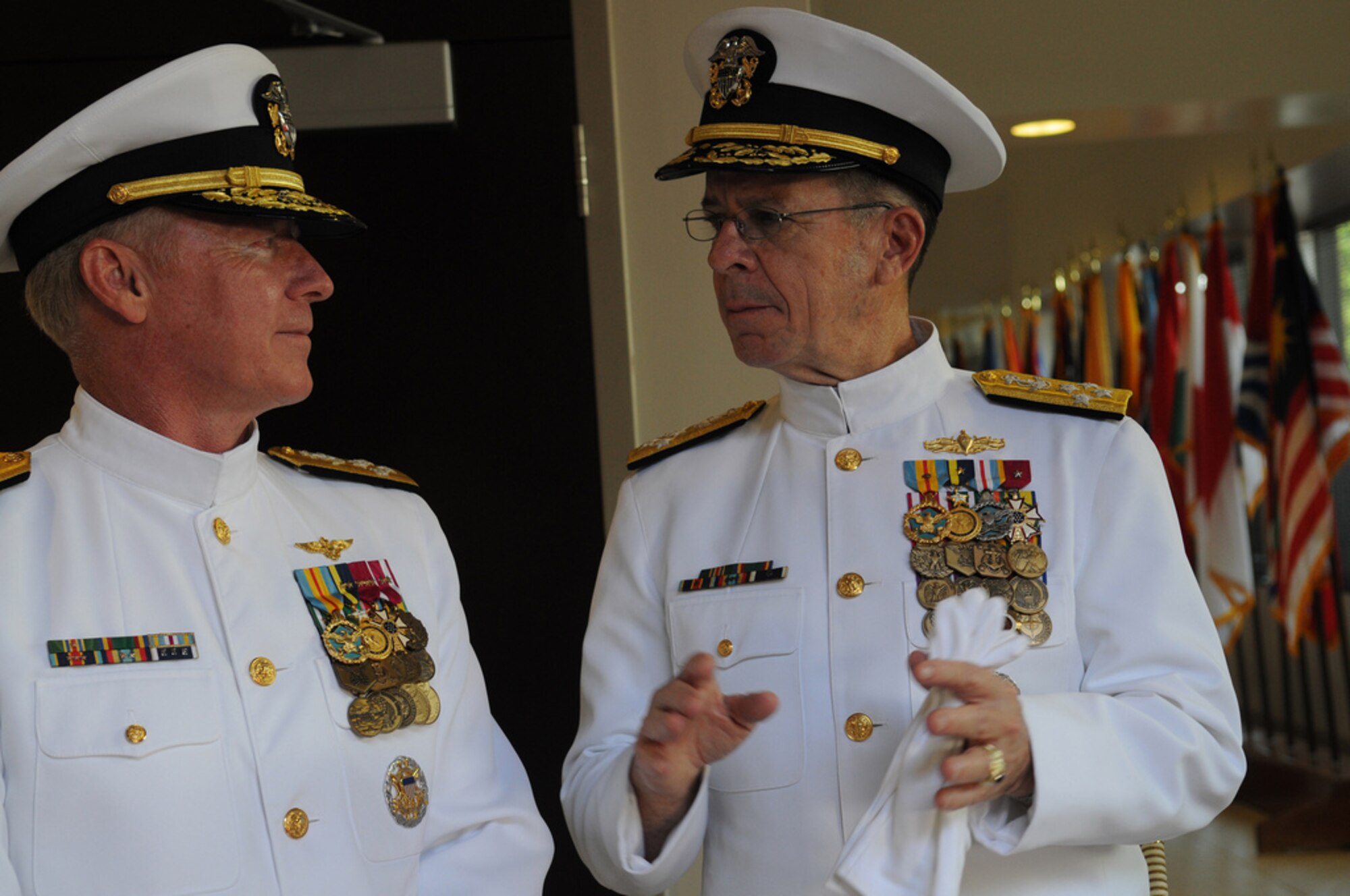 Adm. Robert F. Willard, incoming commander of U.S. Pacific Command, and Adm. Mike Mullen, chairman of the Joint Chiefs of Staff, speak at the conclusion of the U.S. PaCom change of command ceremony Oct. 19, 2009, at Camp H.M. Smith, Hawaii. Admiral Willard, former U.S. Pacific Fleet commander, assumed command of U.S. PaCom from Adm. Timothy J. Keating during the ceremony. (U.S. Navy photo/Navy Petty Officer 2nd Class Elisia V Gonzales)