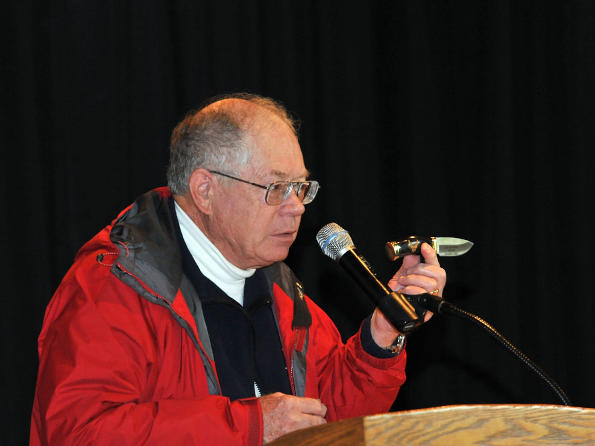 FAIRCHILD AIR FORCE BASE, Wash. – Mr. Graham Crutchfield, a retired Marine, speaks about the importance of recognizing troops who served tours in Iraq or Afghanistan. Mr. Crutchfield also spoke about the commemorative knife program which awards these special keepsakes to United States military members who served.  Crutchfield in partnership with the Buck Knife Company has donated over 800 knives to service members free of charge. These knives are provided through donations and cannot be bought but earned through honorable service in the desert. Crutchfield presented over 73 knifes to Team Fairchild members at the Deel Community center Oct 13. (U.S. Air Force photo / Staff Sgt. JT May III)
