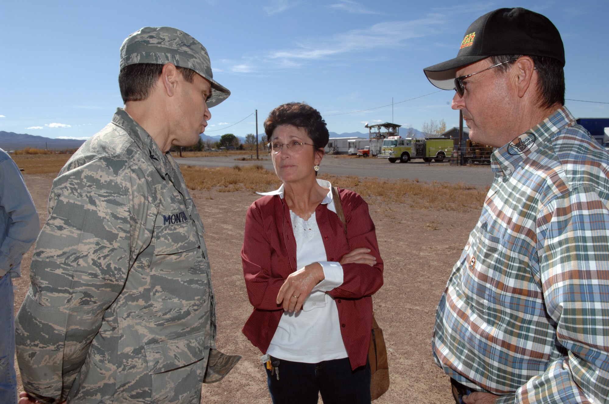 RACHEL, Nev.-- Col. John Montgomery, 98th Range Wing commander, discusses the importance of the Nevada Test and Training Range with Ronda Hornbeck, Lincoln County commissioner and Ed Higbee, Lincoln County commissioner after a town hall meeting held in Rachel, Nev. Oct. 20. The community of Rachel was given a familiarization briefing of the importance of the NTTR and was given an opportunity to ask questions or bring up concerns to wing leadership. (U.S. Air Force photo by Airman 1st Class Michael Charles)