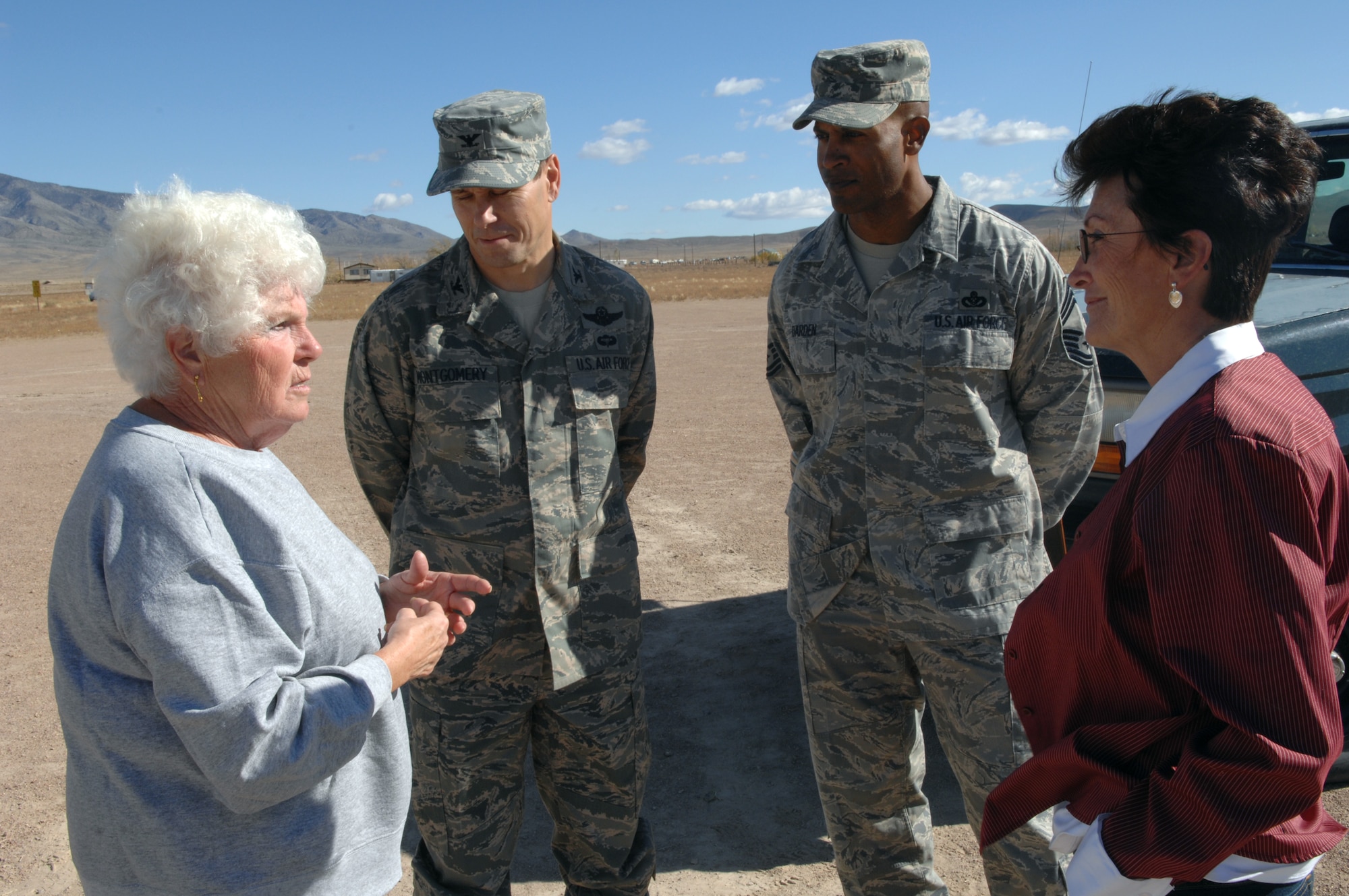 RACHEL, Nev.-- Ruth Miller, a Rachel citizen asks questions about the Nevada test and Training Range to Col. John Montgomery, 98th Range Wing commander, Chief Master Sgt. Mark Darden, 98th Range Wing superintendent and Ronda Hornbeck, Lincoln county commissioner after a town hall meeting there Oct. 20. The community of Rachel was given a familiarization briefing of the importance of the NTTR and was given an opportunity to ask questions or bring up concerns to wing leadership. (U.S. Air Force photo by Airman 1st Class Michael Charles)