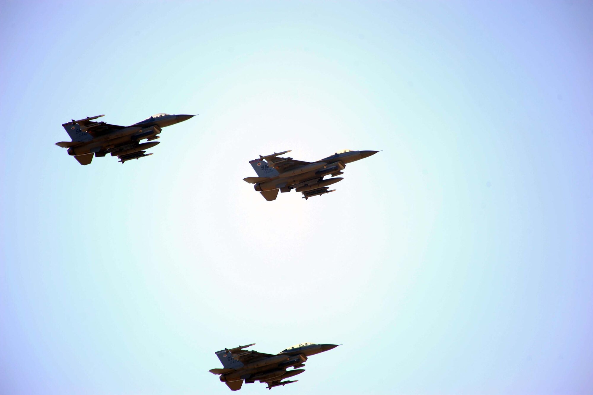 SHAW AIR FORCE BASE, S.C. -- The 77th Fighter Squadron "Gamblers" perform a missing man flyover during a memorial ceremony honoring Capt. Nicholas Giglio Oct. 22. Captain Giglio was killed in an F-16 mid-air collision over the Atlantic last week. (U.S. Air Force photo/ Senior Airman Matt Davis)