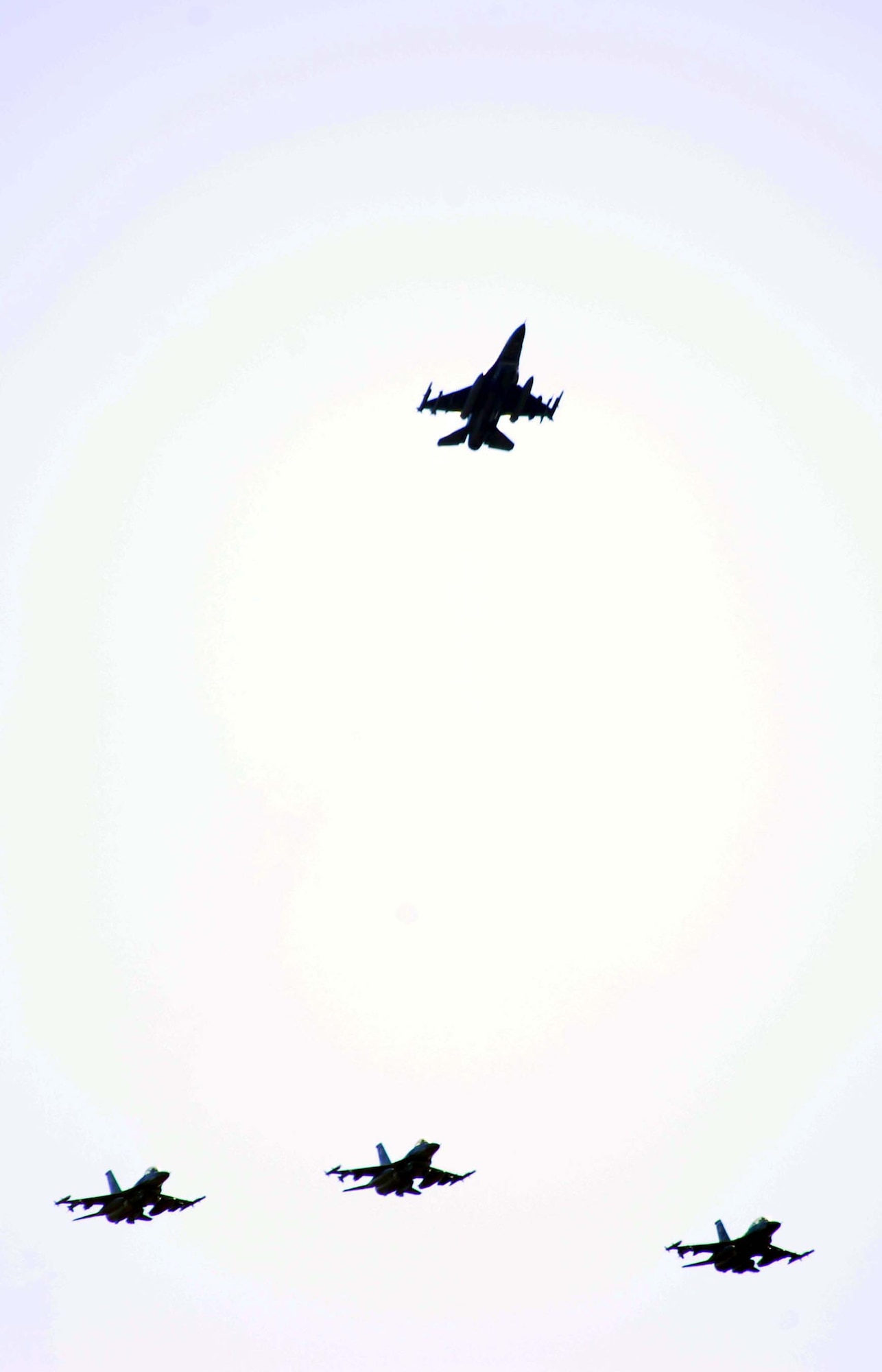 SHAW AIR FORCE BASE, S.C. -- The 77th Fighter Squadron "Gamblers" perform a missing man flyover during a memorial ceremony honoring Capt. Nicholas Giglio Oct. 22. Captain Giglio was killed in a mid-air collision over the Atlantic last week. (U.S. Air Force photo/ Senior Airman Matt Davis)