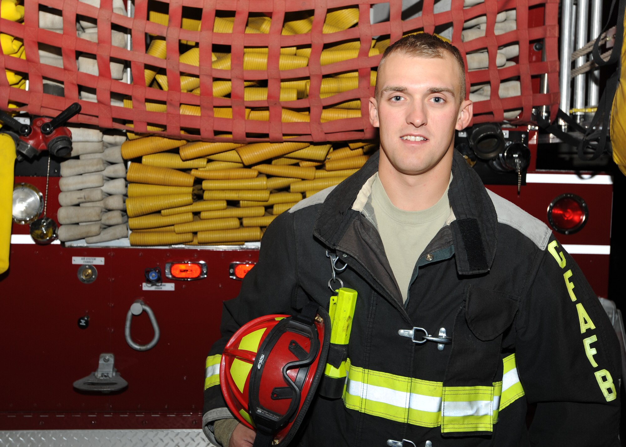 Staff Sgt. Zachery J. Hedquist, 319th Civil Engineer Squadron, poses for a photo Oct. 14 at the fire department on Grand Forks Air Force Base, N.D. Sergeant Hedquist was announced as the base’s third quarter NCO of the Quarter. (U.S. Air Force photo by Staff Sgt. Suelynn F. Nuckolls)