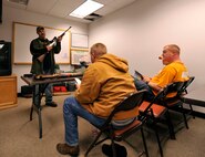 MINOT AIR FORCE BASE, N.D. -- Tech. Sgt. Jeremy Meier, 5th Operations Group noncommissioned officer-in-charge target intelligence and hunters safety course instructor, demonstrates the safe procedures for handling a .270-caliber rifle. The safety course is designed to put safe and educated hunters into the field. (U.S. Air Force photo by Senior Airman Matthew Smith)