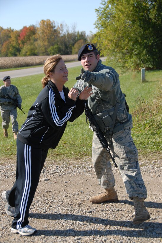 MSgt. Tabatha King tries to get past SrA. John McKinnon of 178th Security Forces Squadron during the Major Accident Response Exercise October 18, 2009 in Springfield, OH.  King was participating as a parent who's child was involved in the accident.  