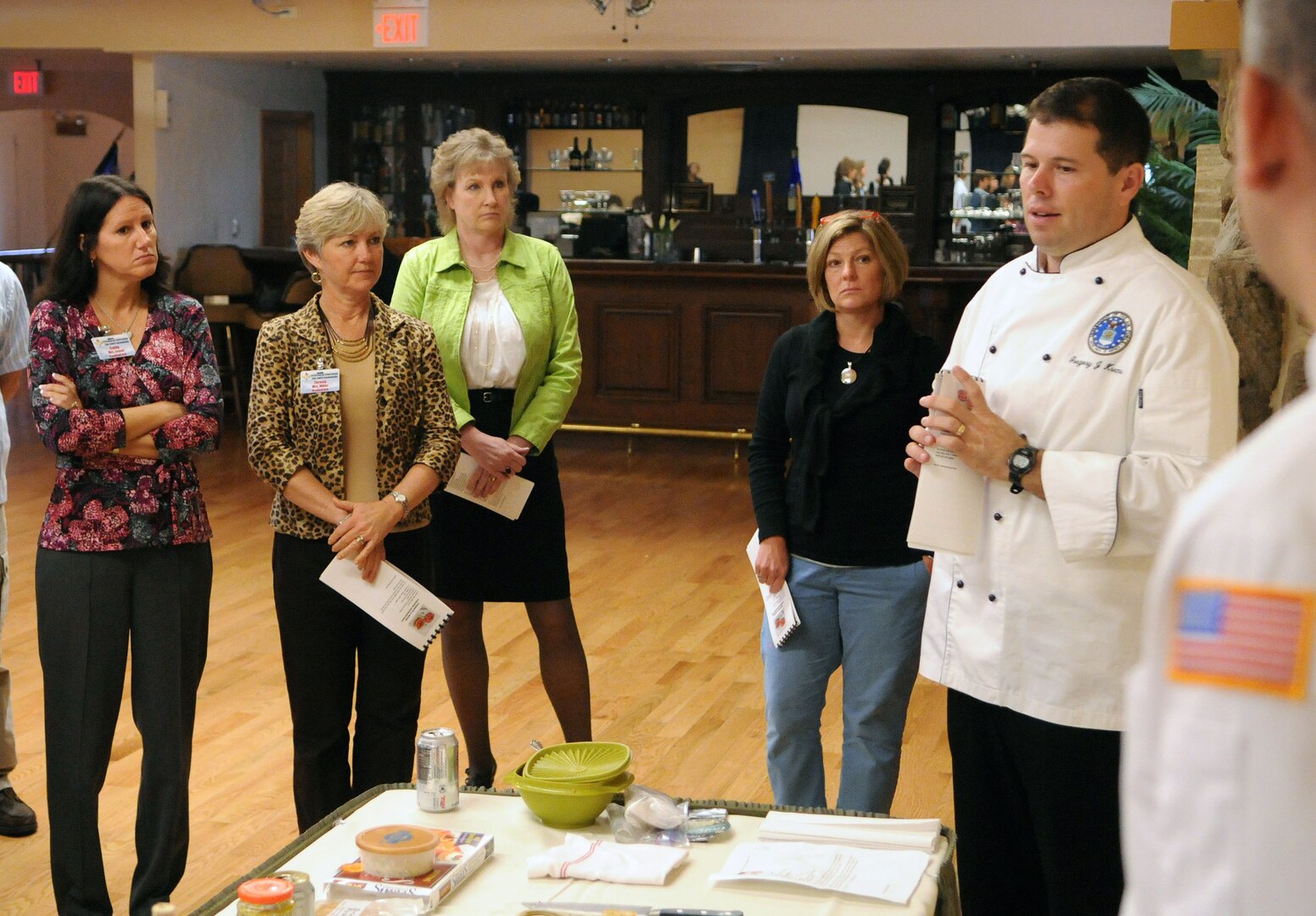 Master Sgt. Greg Krems, enlisted aide to the Air Education and Training Command commanders, explains to spouses during the AETC Commanders, Command Chiefs and Spouses conference at Randolph Air Force Base, how they are going to make an appetizer during the Appetizer Demonstration at the Randolph's Parr O' Club. (U.S. Air Force Photo By Don Lindsey)