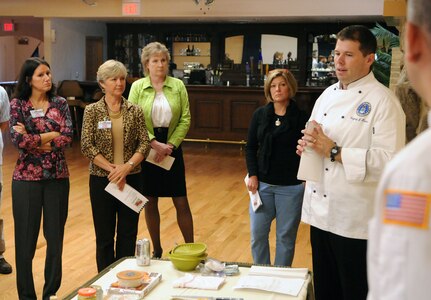 Master Sgt. Greg Krems, enlisted aide to the Air Education and Training Command commanders, explains to spouses during the AETC Commanders, Command Chiefs and Spouses conference at Randolph Air Force Base, how they are going to make an appetizer during the Appetizer Demonstration at the Randolph's Parr O' Club. (U.S. Air Force Photo By Don Lindsey)